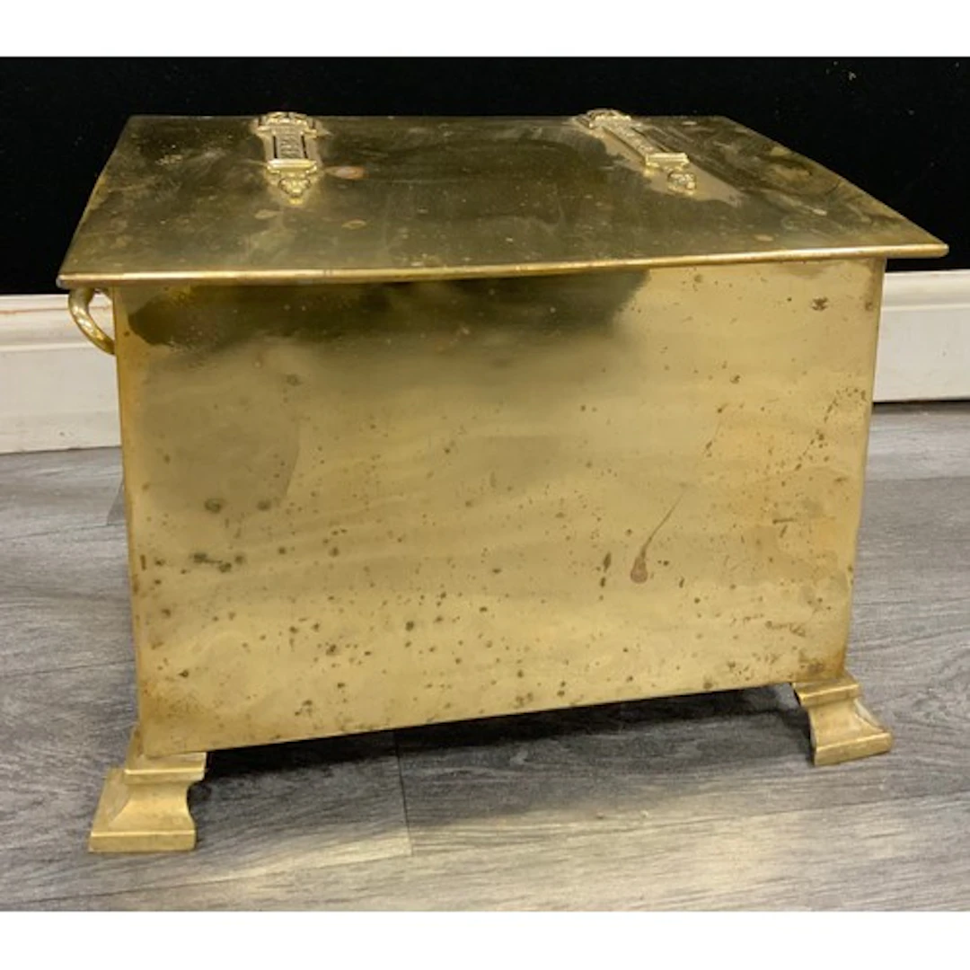 An arts and crafts brass fuel bin with rectangular flat top ...