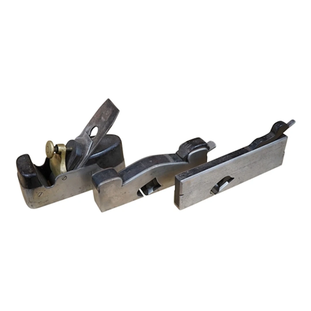 Three woodworking planes: a coffin shaped smoothing plane fi...