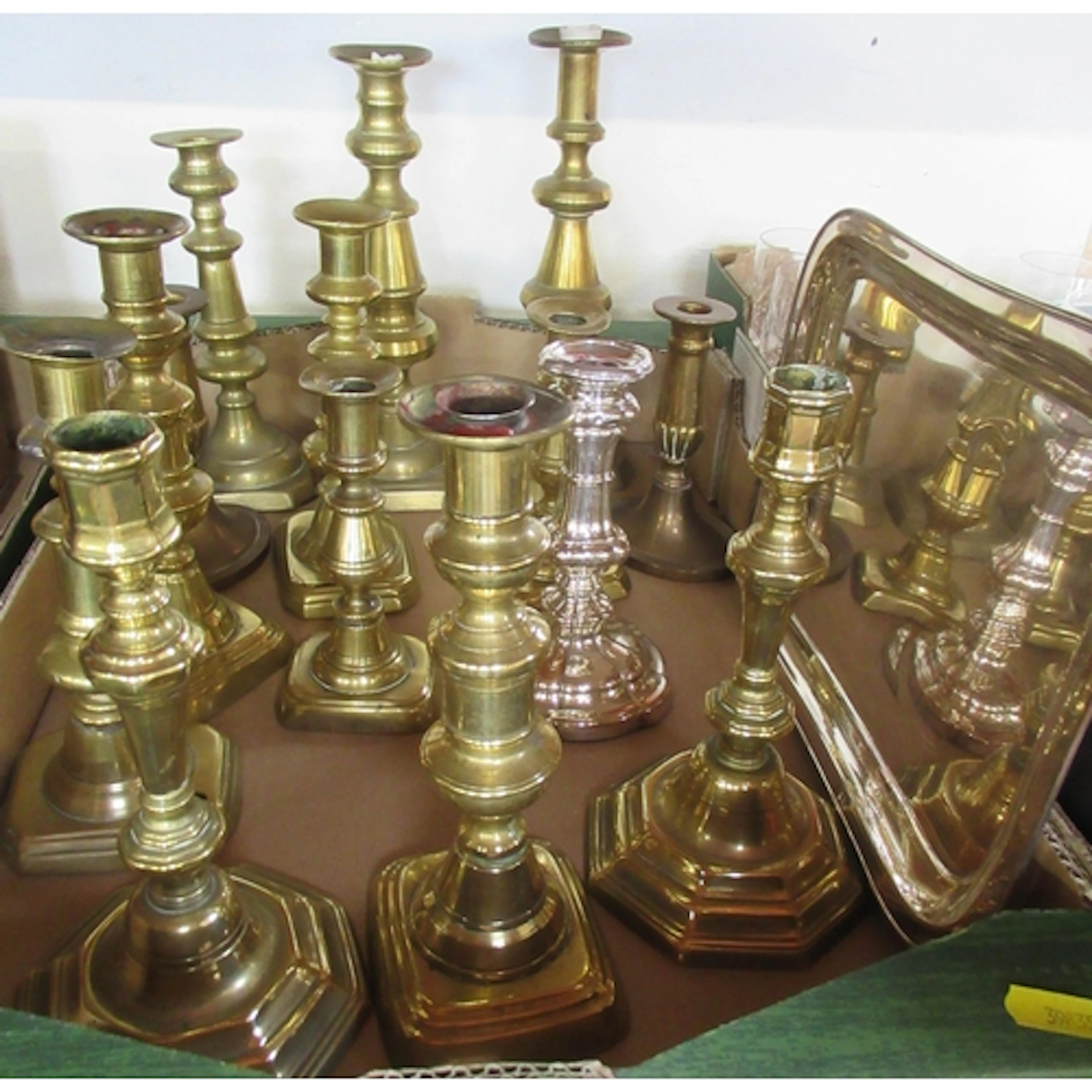 A collection of Antique design candle sticks together with a...