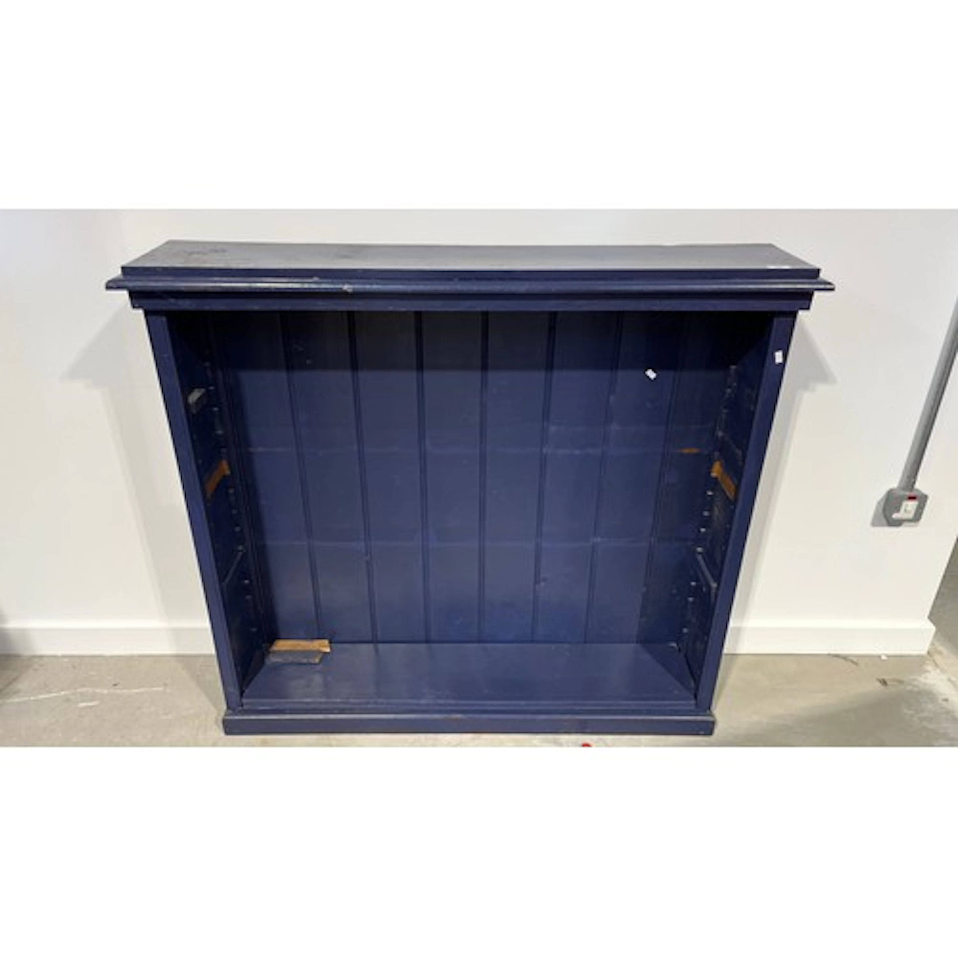 Blue painted open fronted bookcase, 124cm x 113cm.