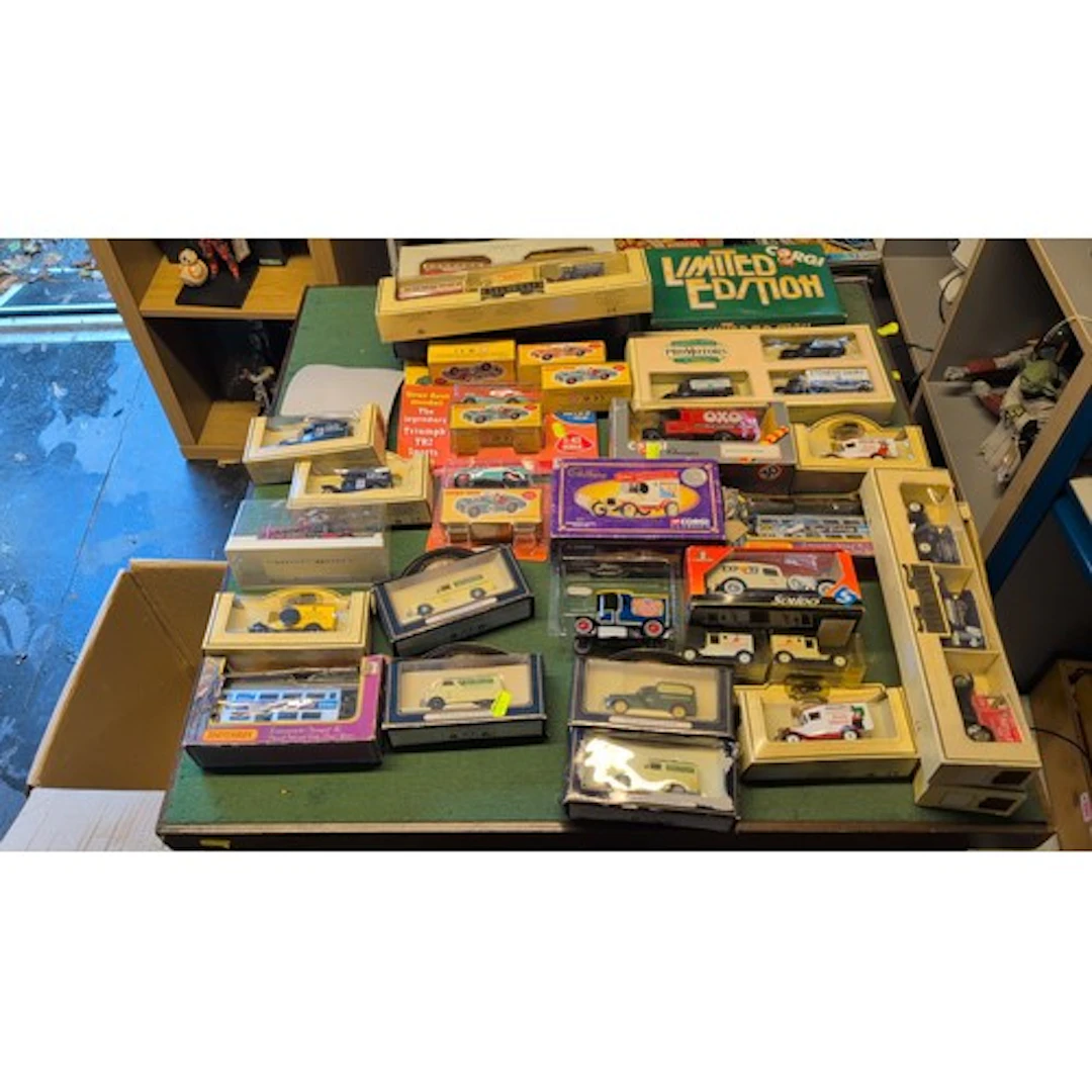 A collection of boxed die-cast model vehicles by Corgi, Dink...