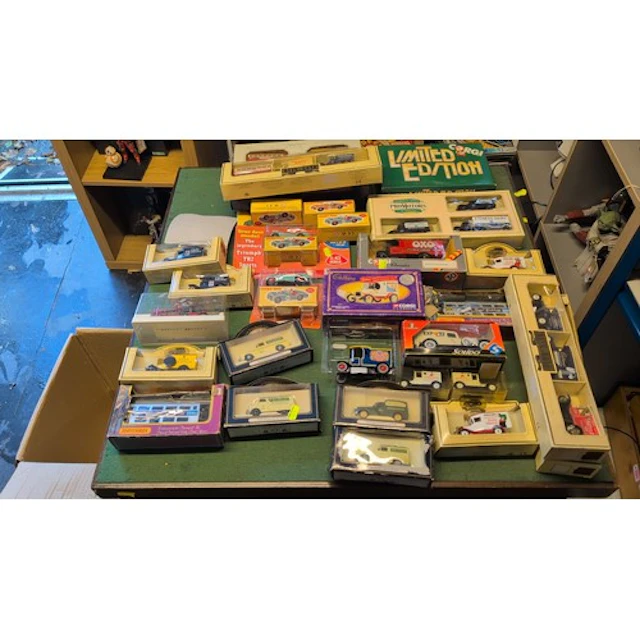 A collection of boxed die-cast model vehicles by Corgi, Dink...