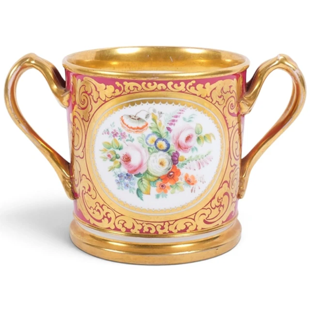 A large Antique Staffordshire loving cup, hand-painted flora...