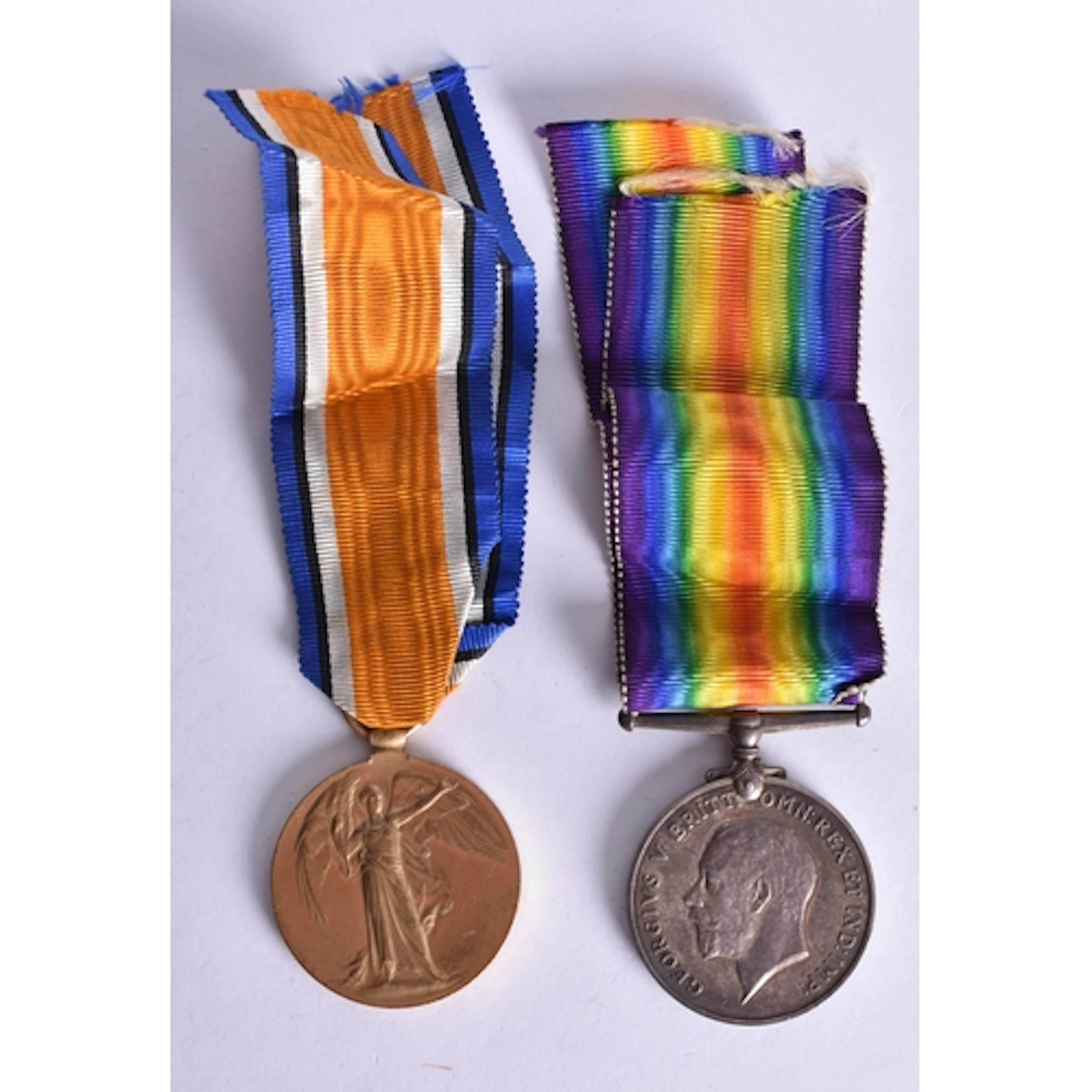 A PAIR OF WWI MEDALS presented to 127703 GNR R W Myatt RA.