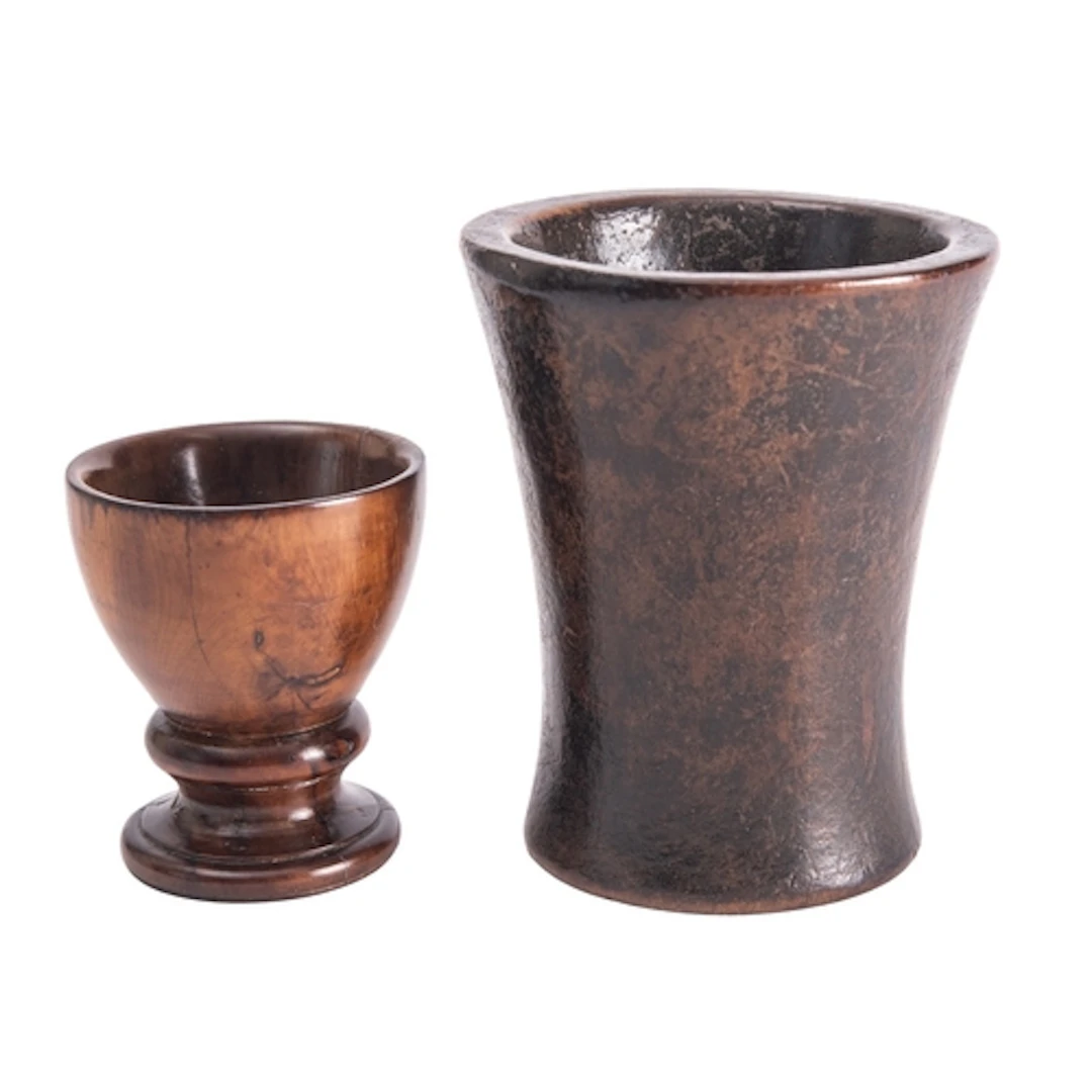 A turned treen pedestal salt, 19th century; with knopped and...