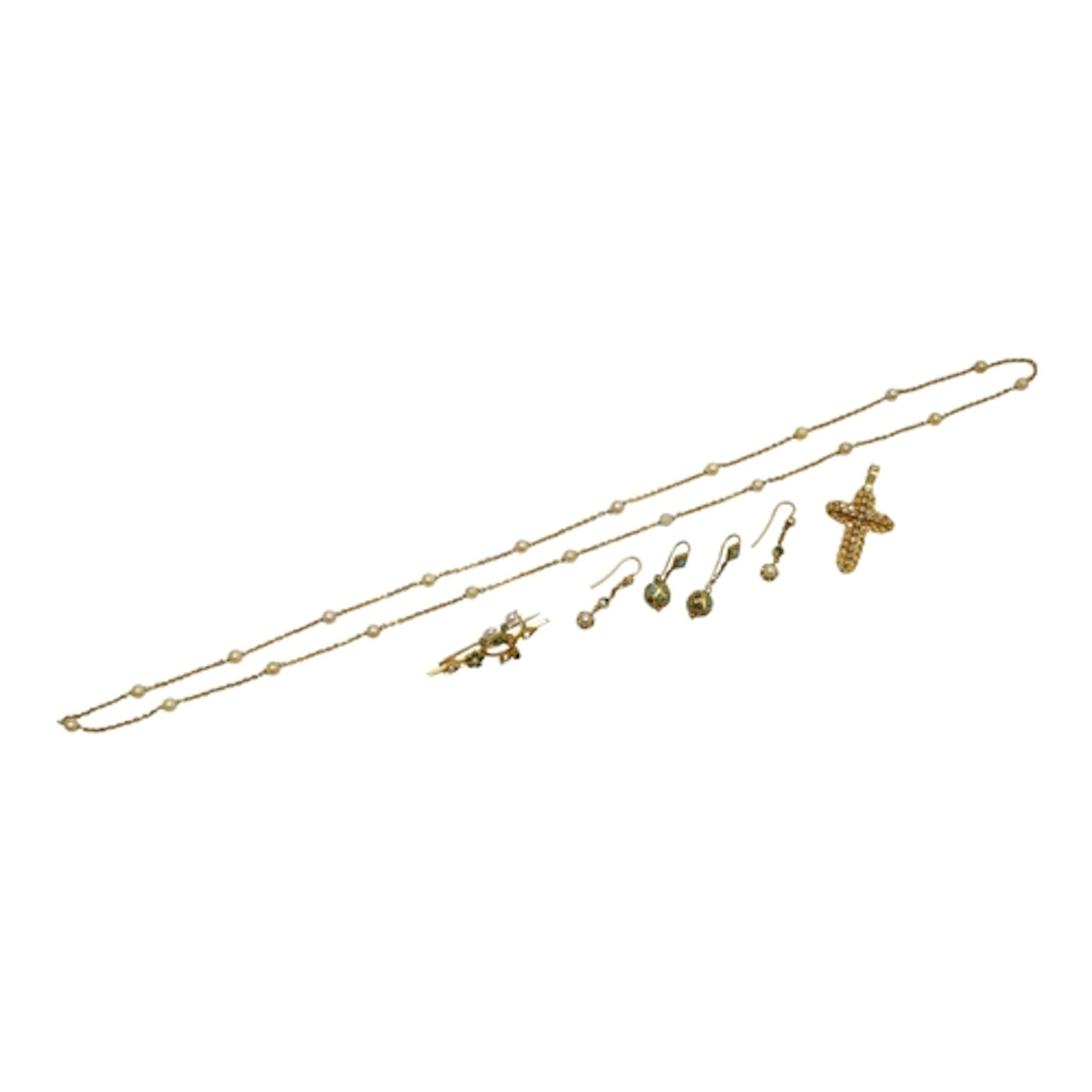 A collection of gold jewels, comprising: a filigree cross pe...