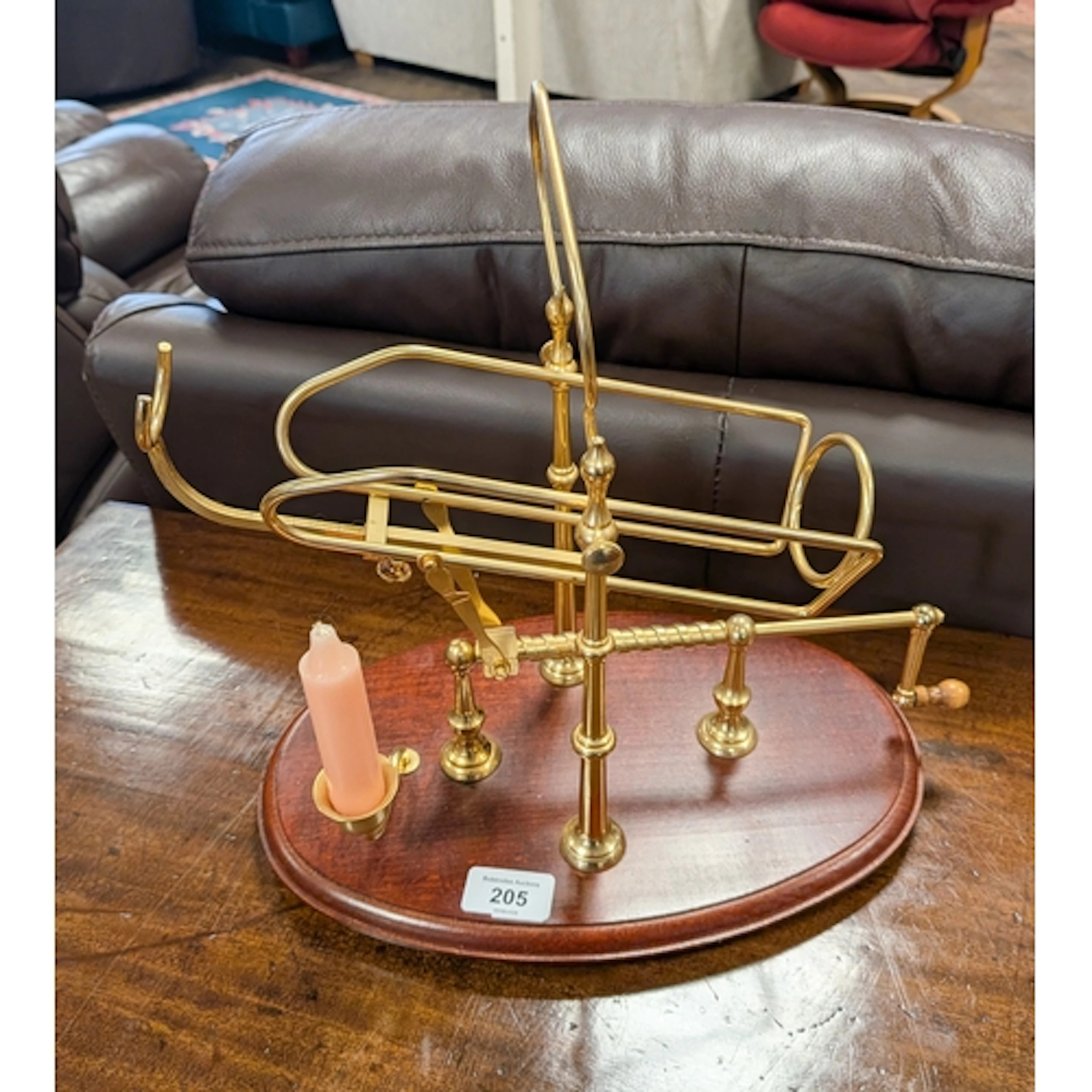 A brass mounted brandy bottle pourer