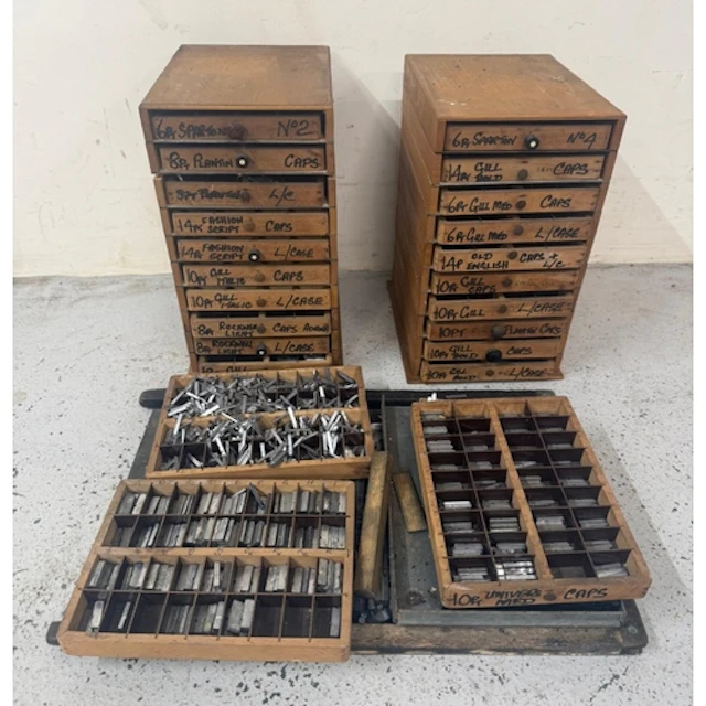 Two sets of printers drawers and a large quantity of typeset...