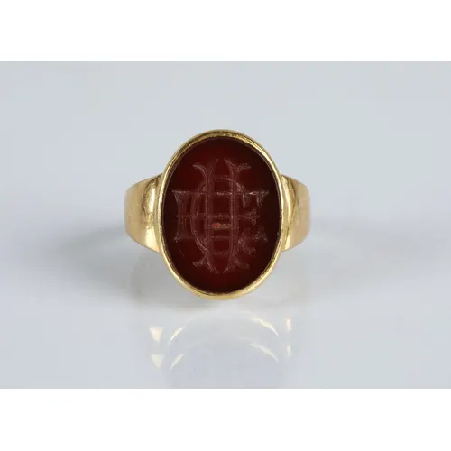 18ct gold seal ring inset with carved carnelian intaglio 'EC...