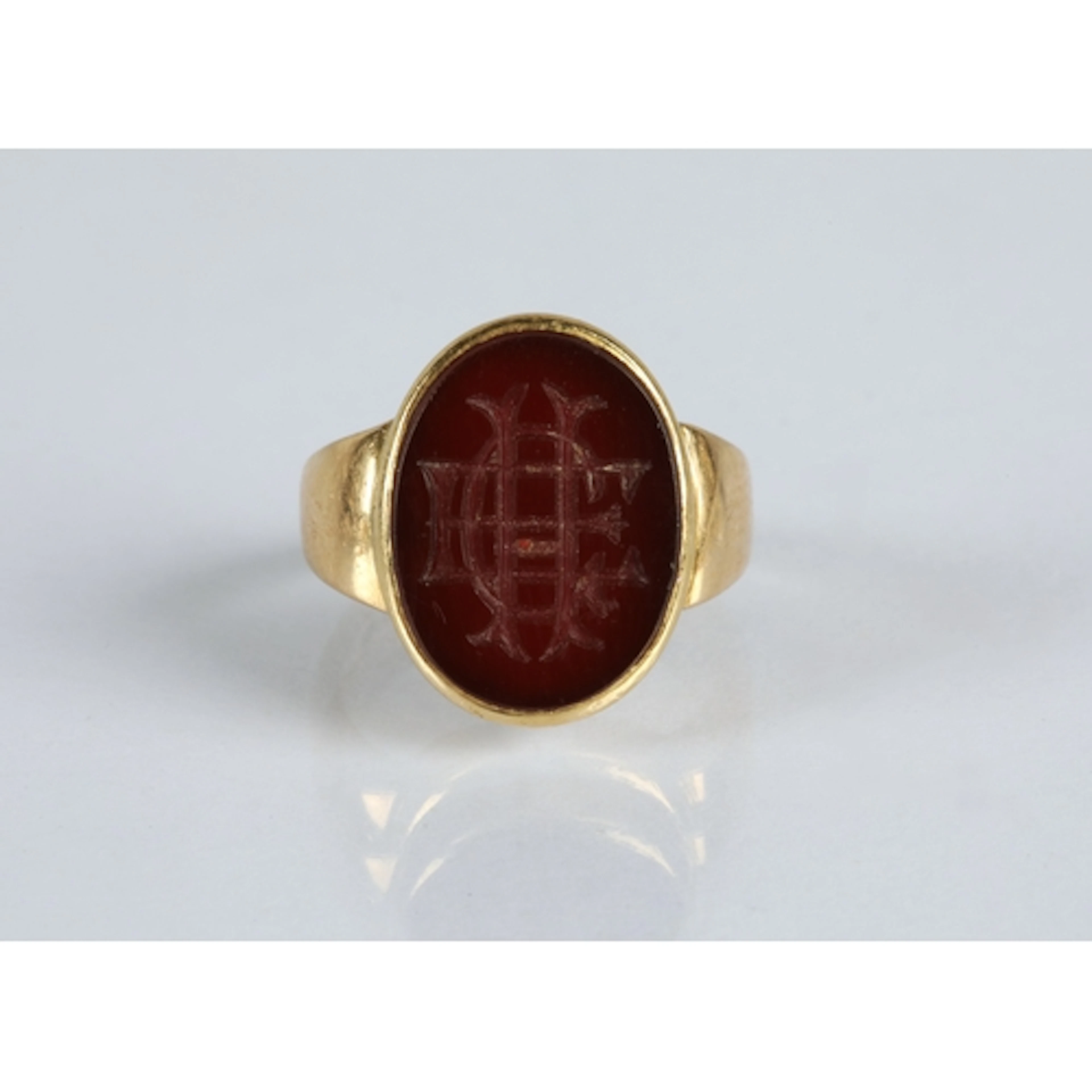 18ct gold seal ring inset with carved carnelian intaglio 'EC...