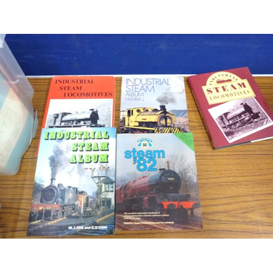 Two boxes of vintage steam locomotive and mining books.