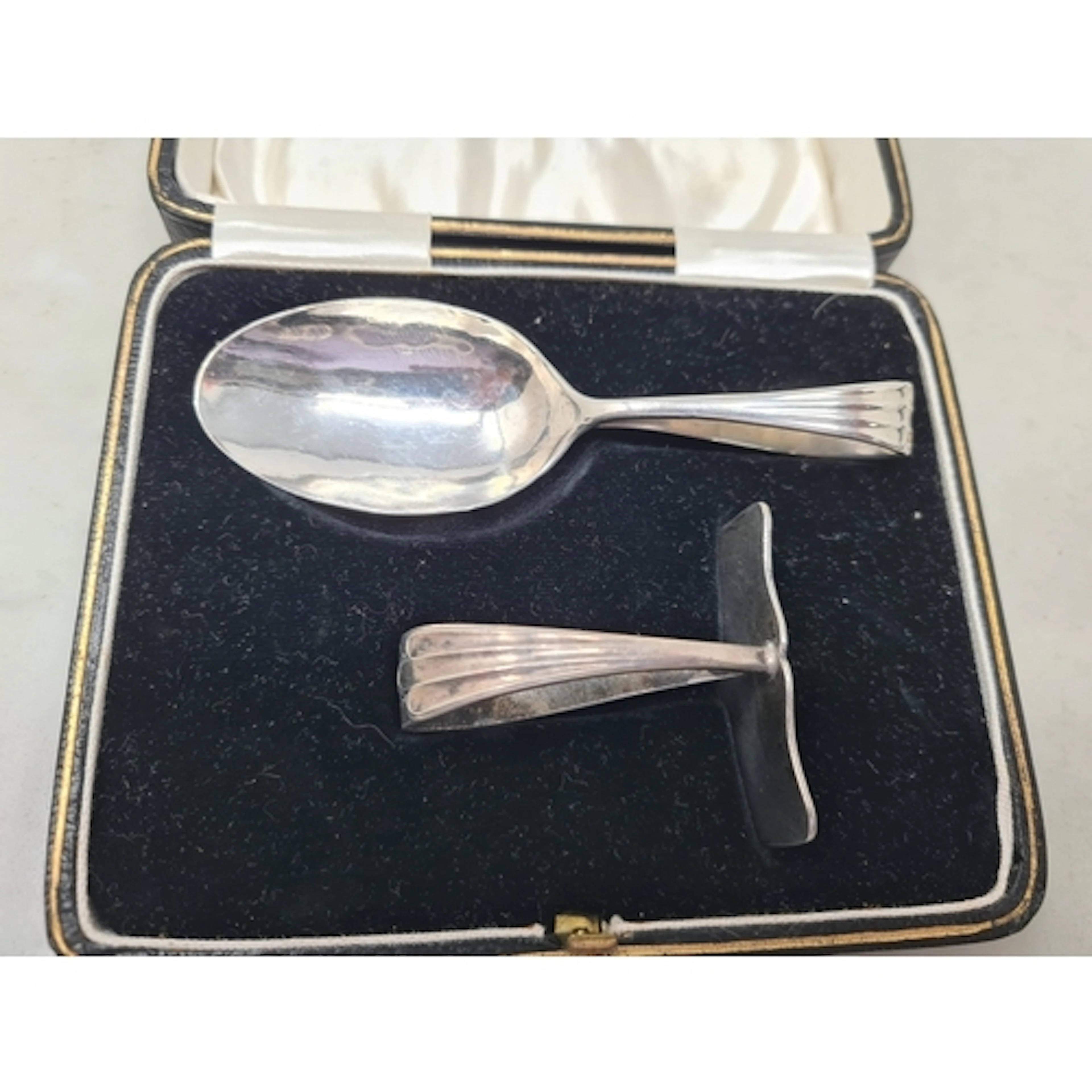 A George V silver Spoon and Pusher, Birmingham 1930, in case...