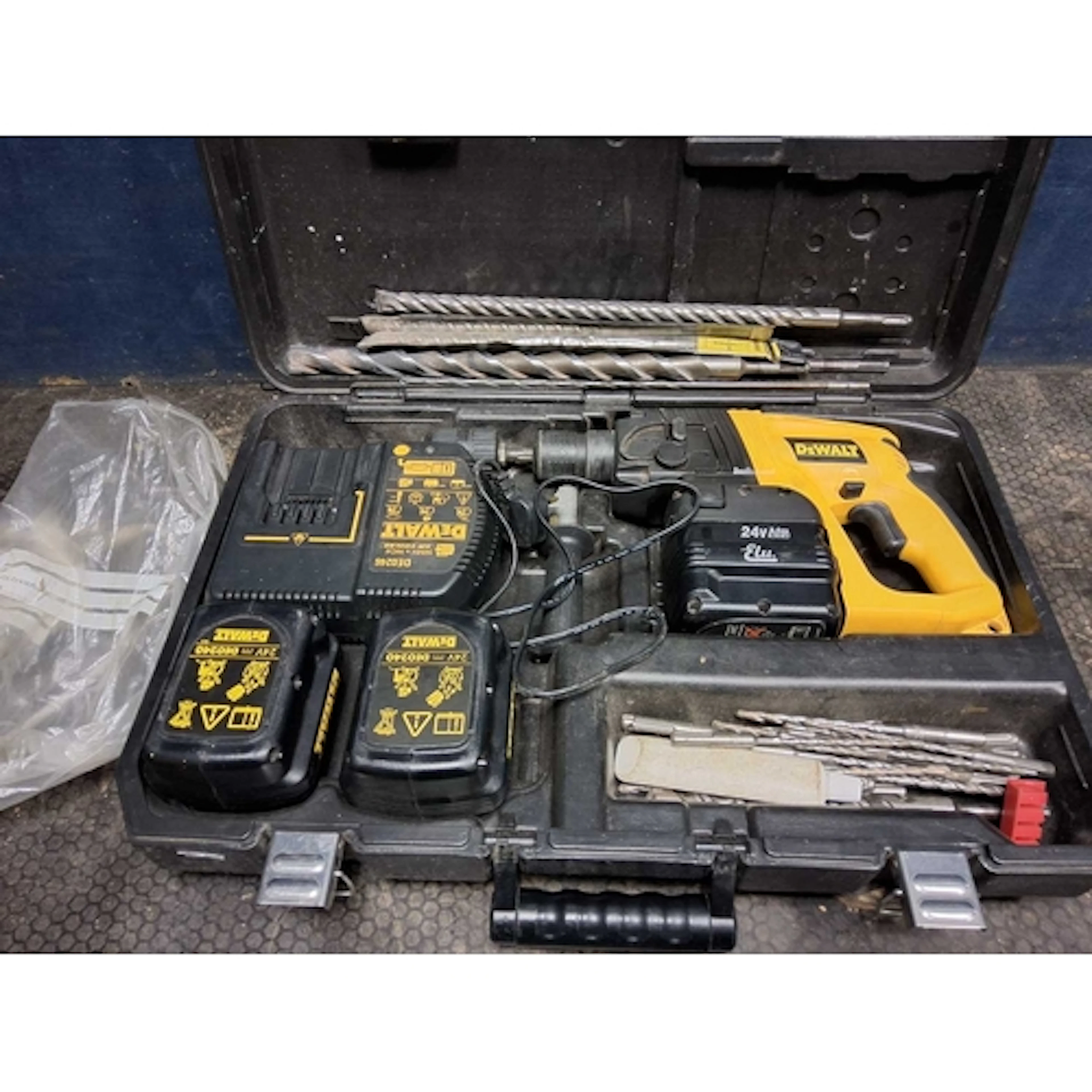 A DeWALT DW004 24V SDS DRILL with case, two DE0240 and one E...