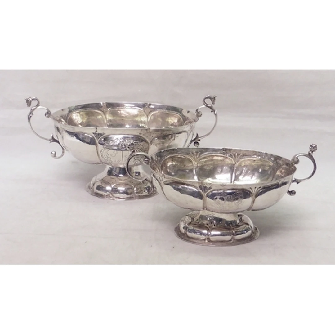 Two Dutch two-handled pedestal brandy cups engraved with ear...