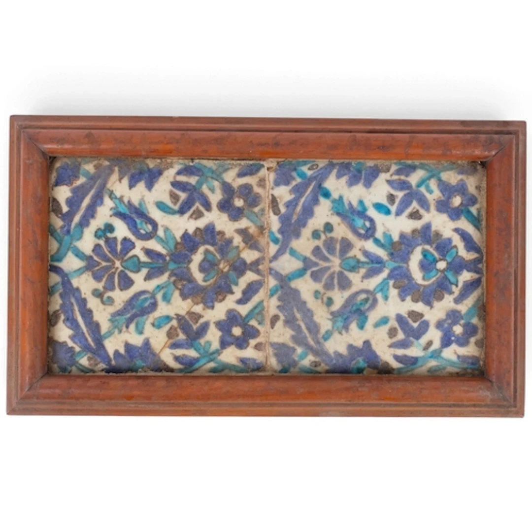 A pair of Antique Iznik hand-painted ceramic tiles, mounted ...