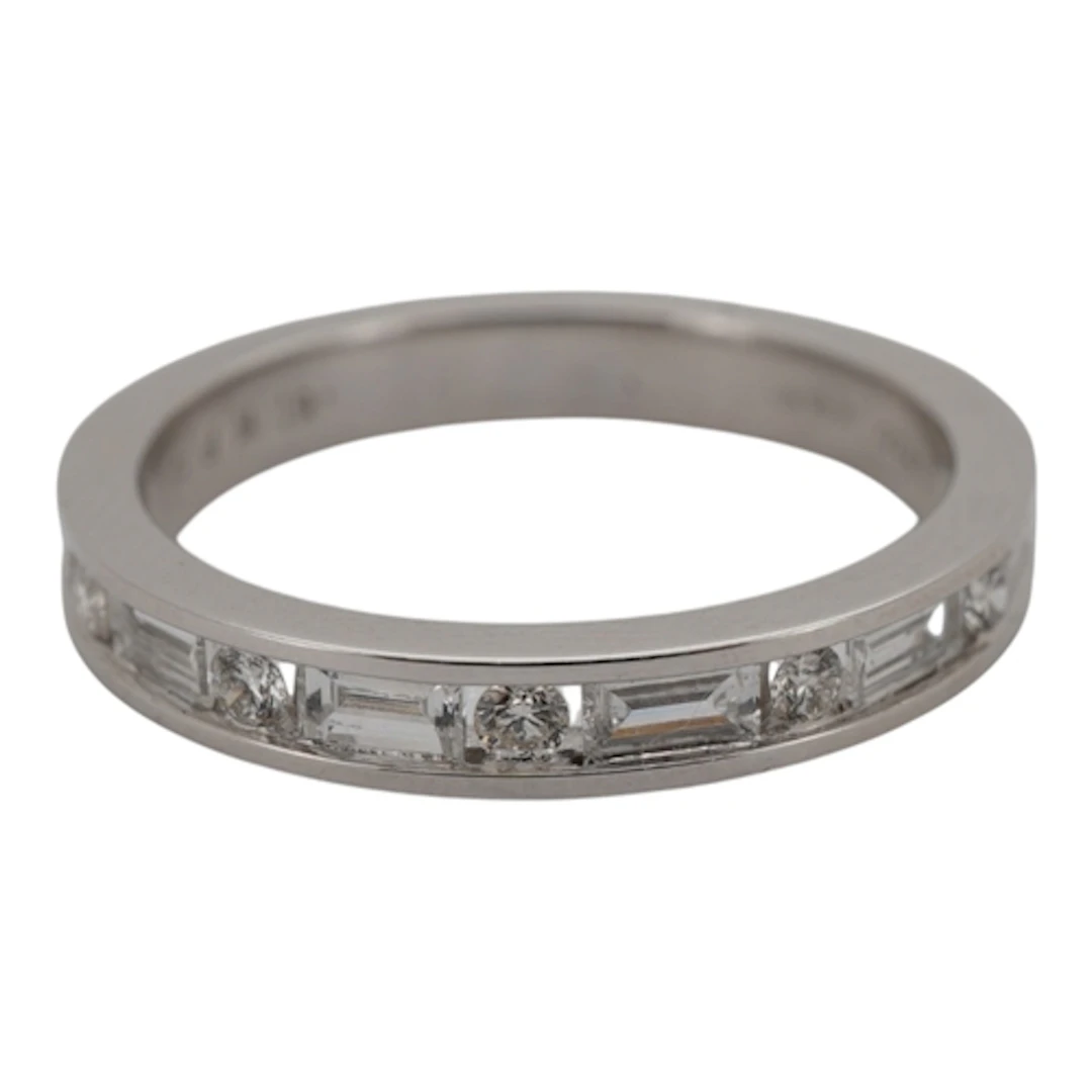 A diamond half eternity ring, channel-set to the front with ...