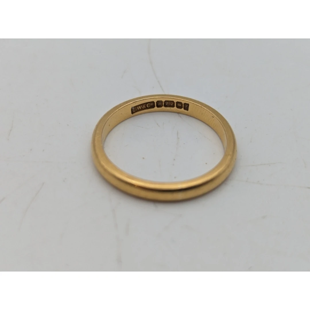 A 22ct gold wedding ring, size L1/2, 3.42g Location: If ther...