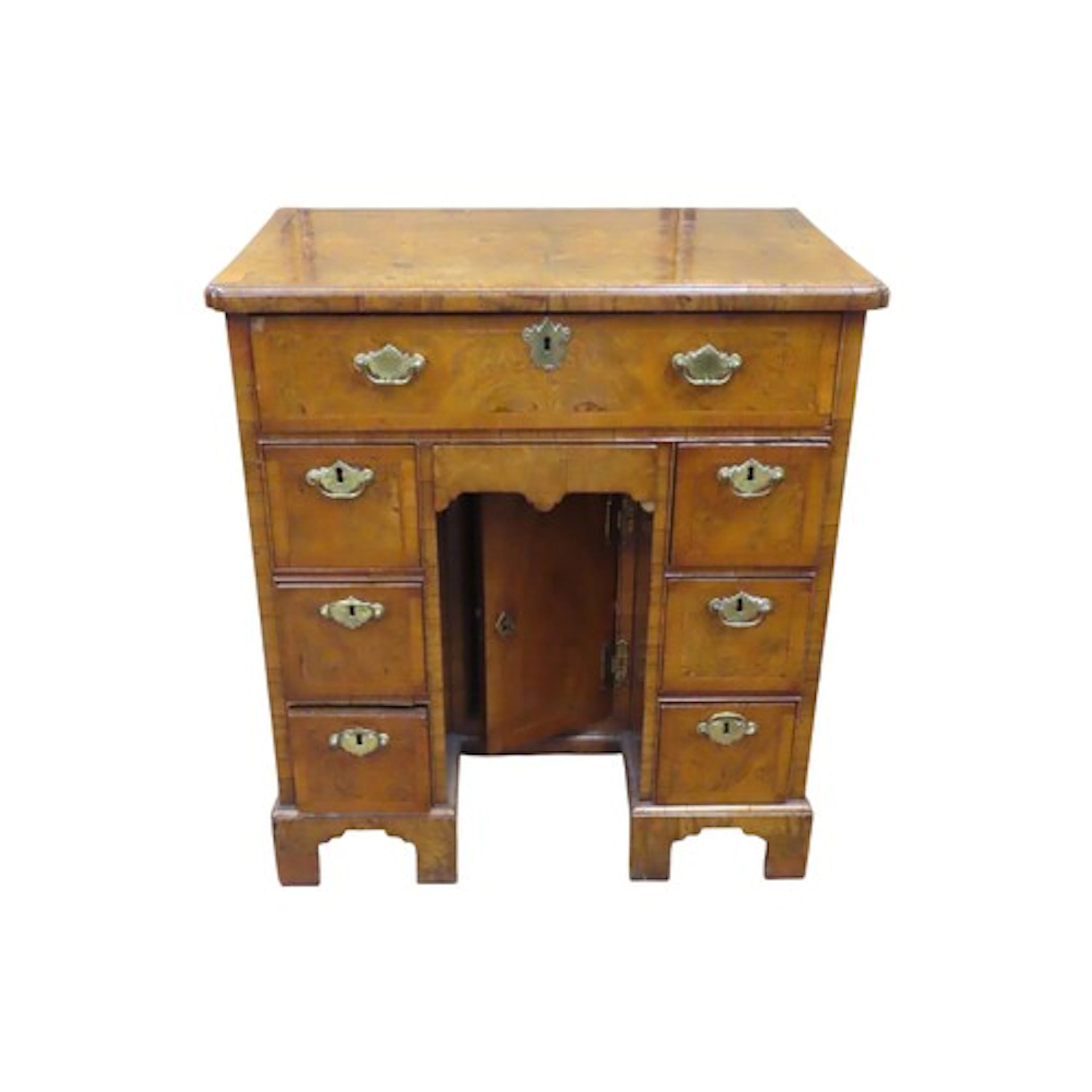A George III kneehole writing desk in burr walnut with eight...