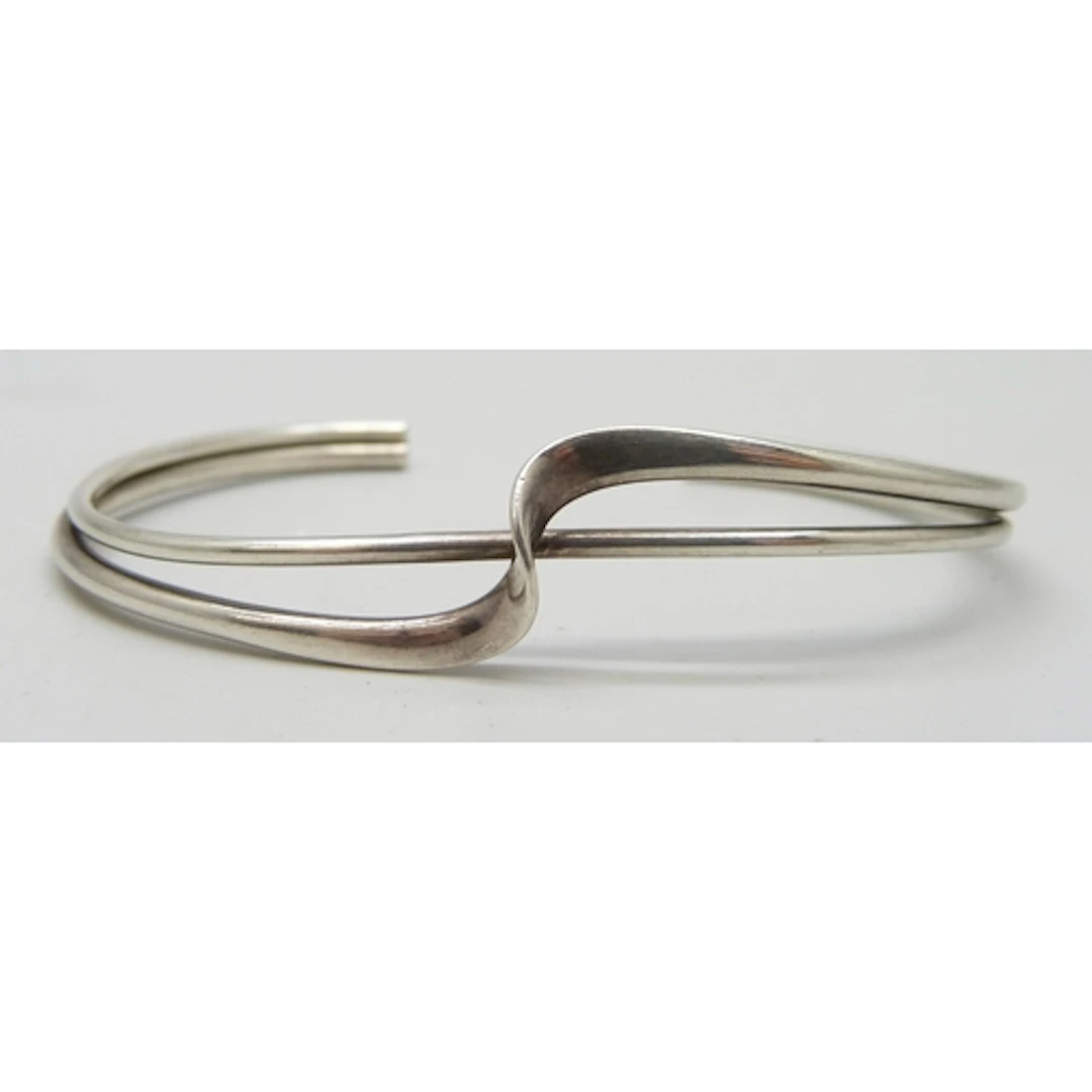 A silver torque bangle, hallmarked, 6.5 x 4.3cm