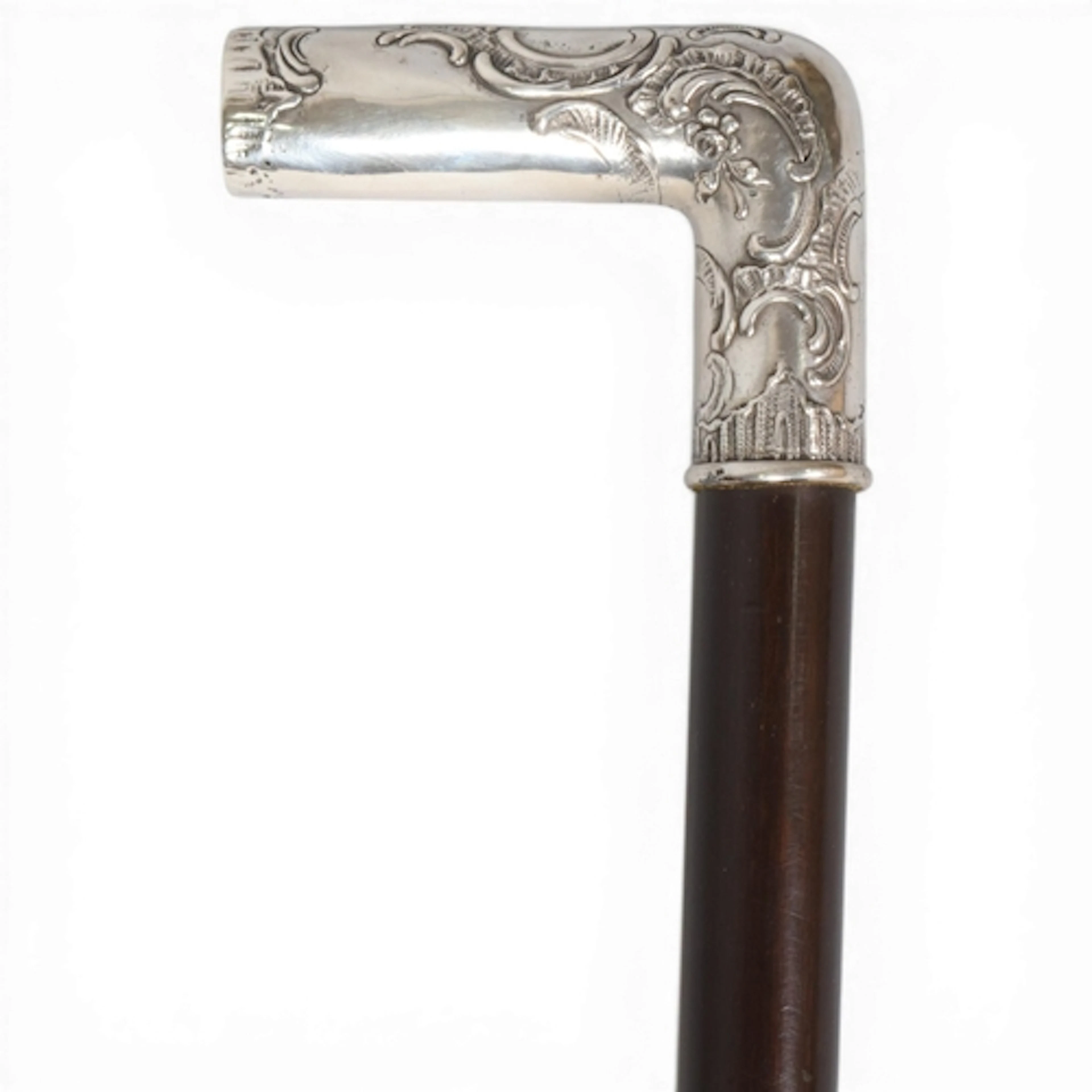 A fine antique evening cane - the silver handle embossed wit...