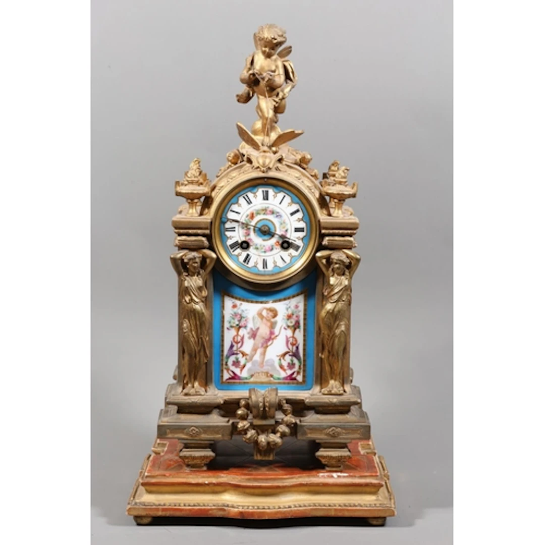 Continental mantel clock mounted by cherub and butterfly, ci...