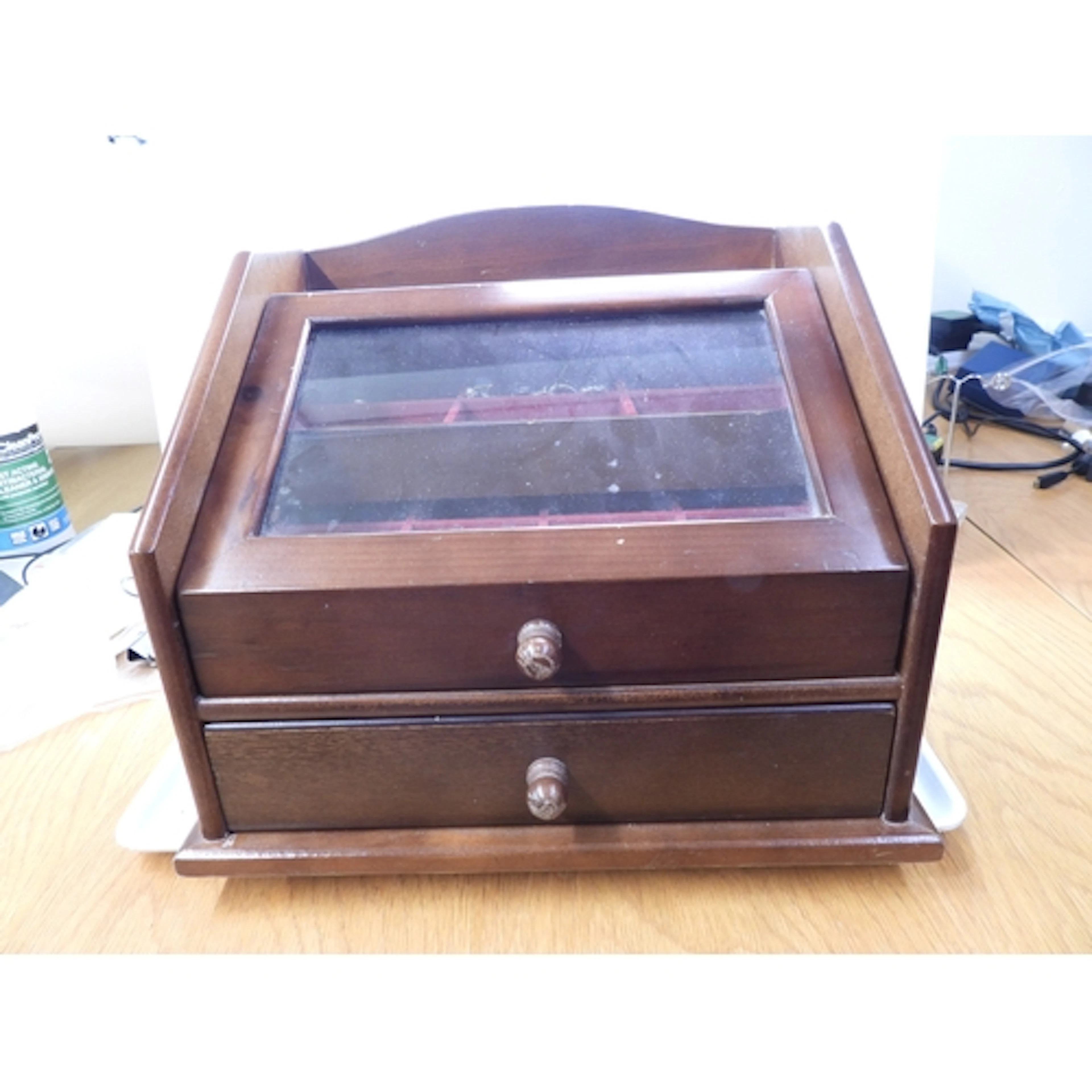 A collection of silver and costume jewellery in a wooden box...