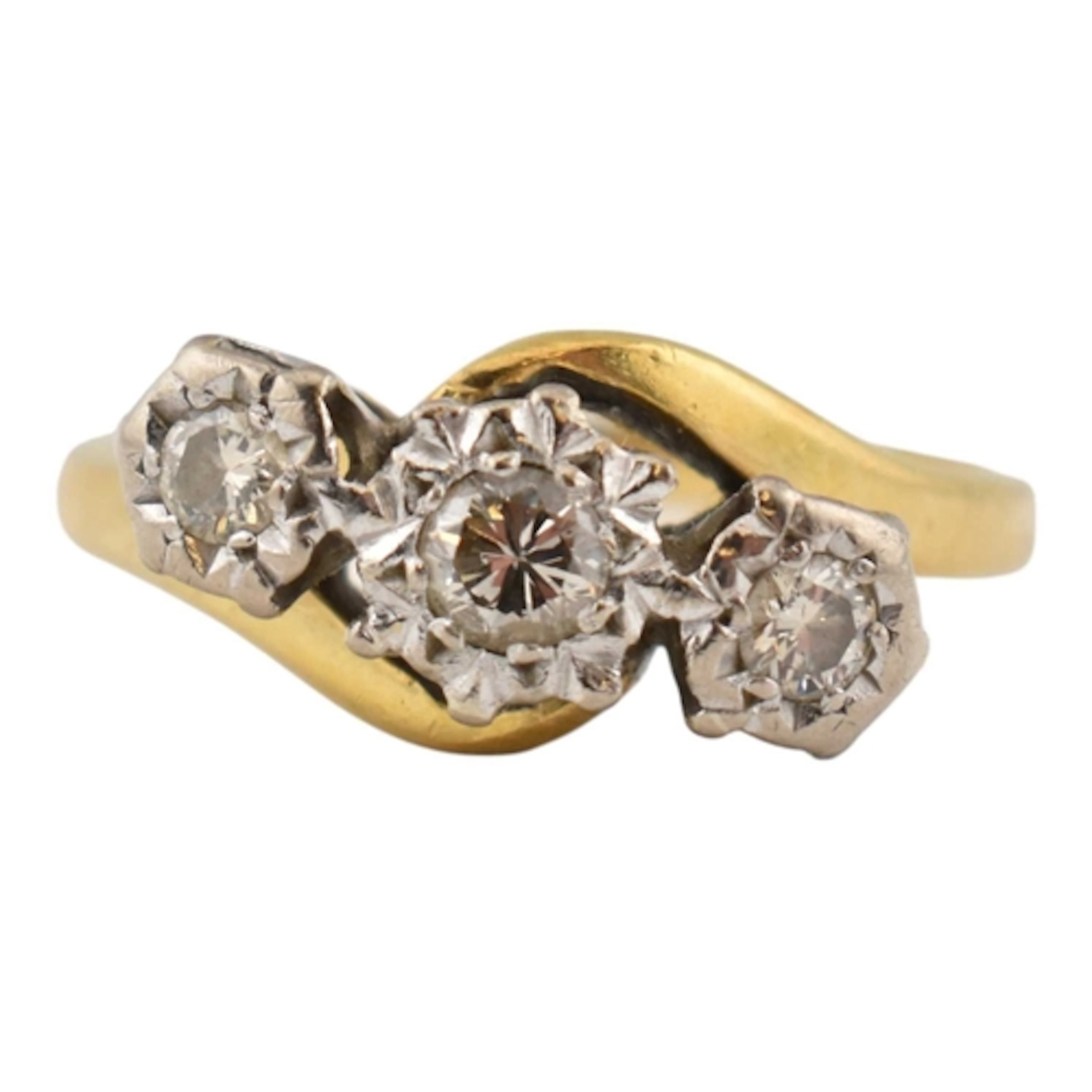 A hallmarked 18ct gold and diamond three stone ring. The rin...