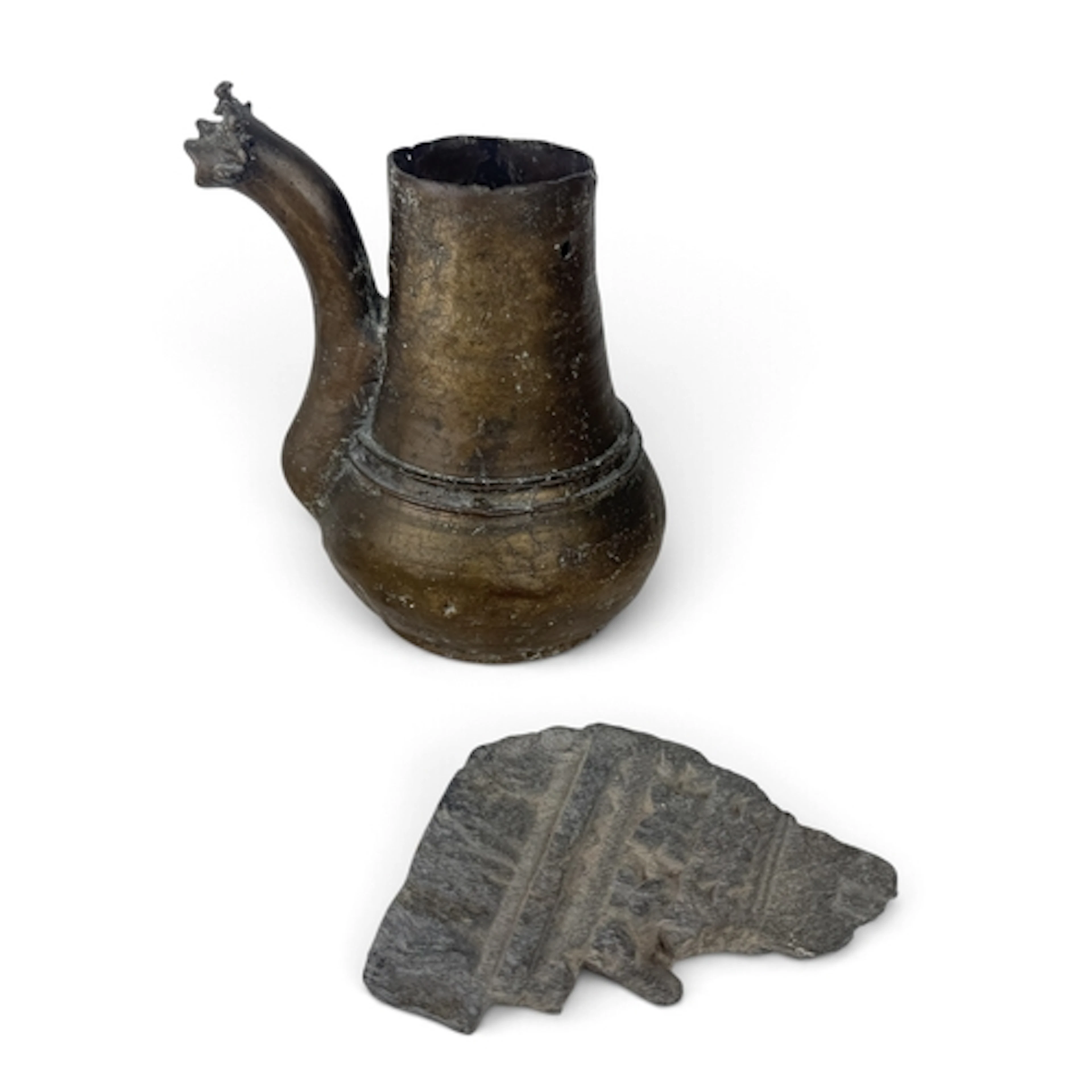 AN ISLAMIC BRONZE POT WITH FIGURAL SPOUT TOGETHER WITH A CAR...