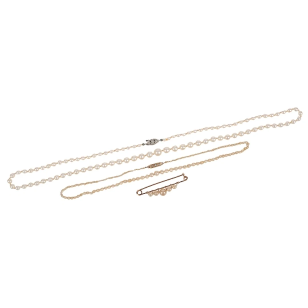 Two cultured pearl necklaces and a brooch, comprising: a sin...