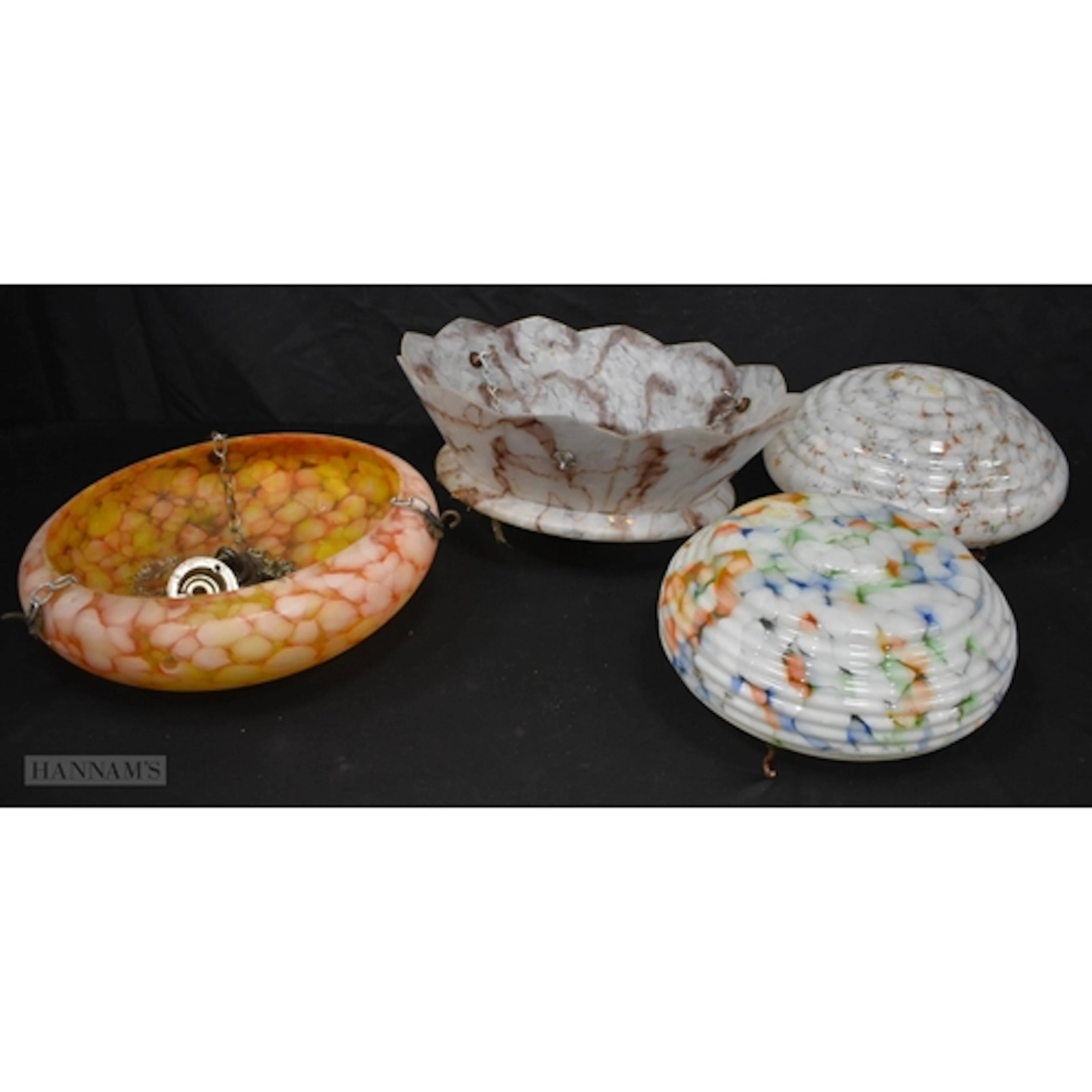 A collection of vintage art deco style glass lamp shades, la...