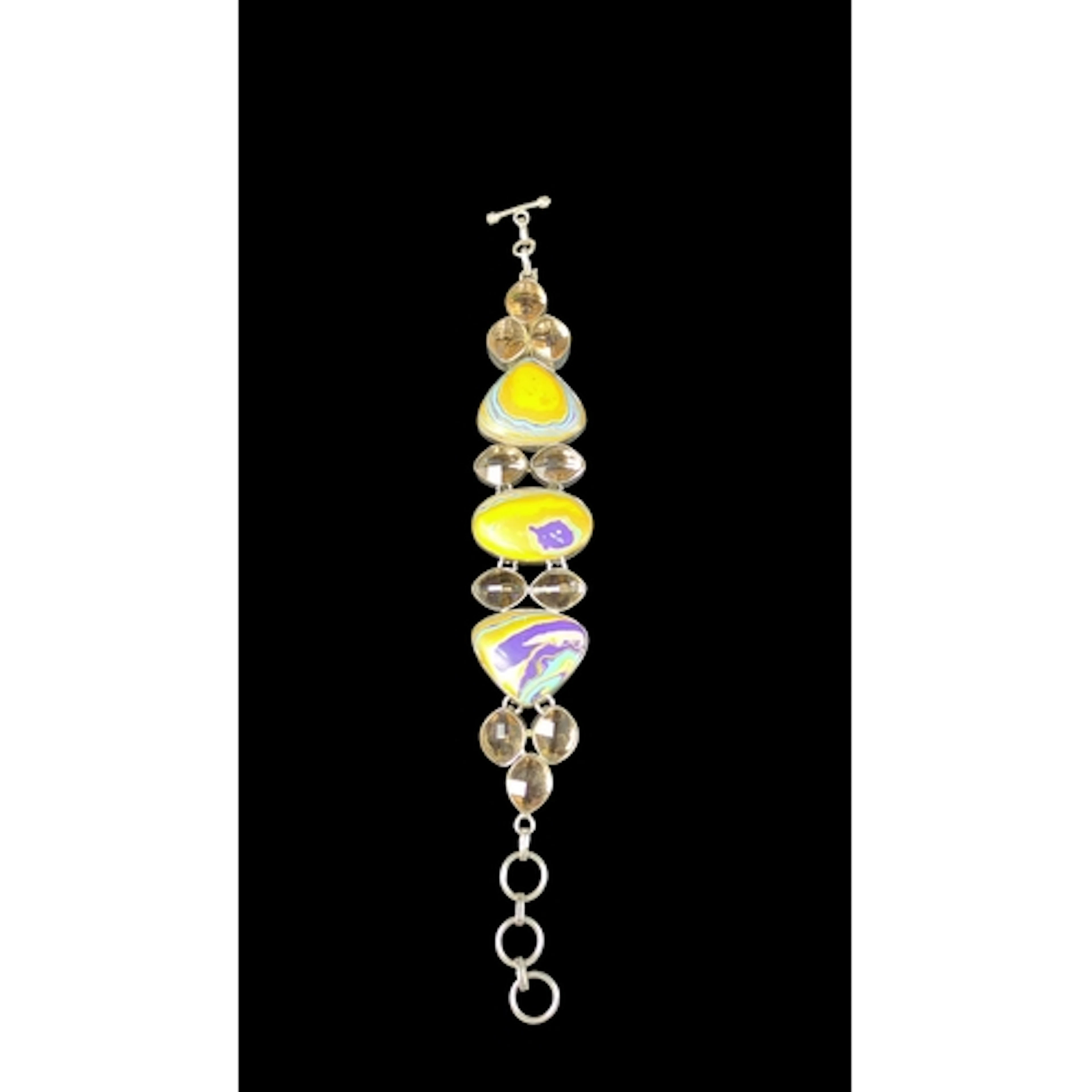 Sterling silver articulated bracelet set with three multicol...