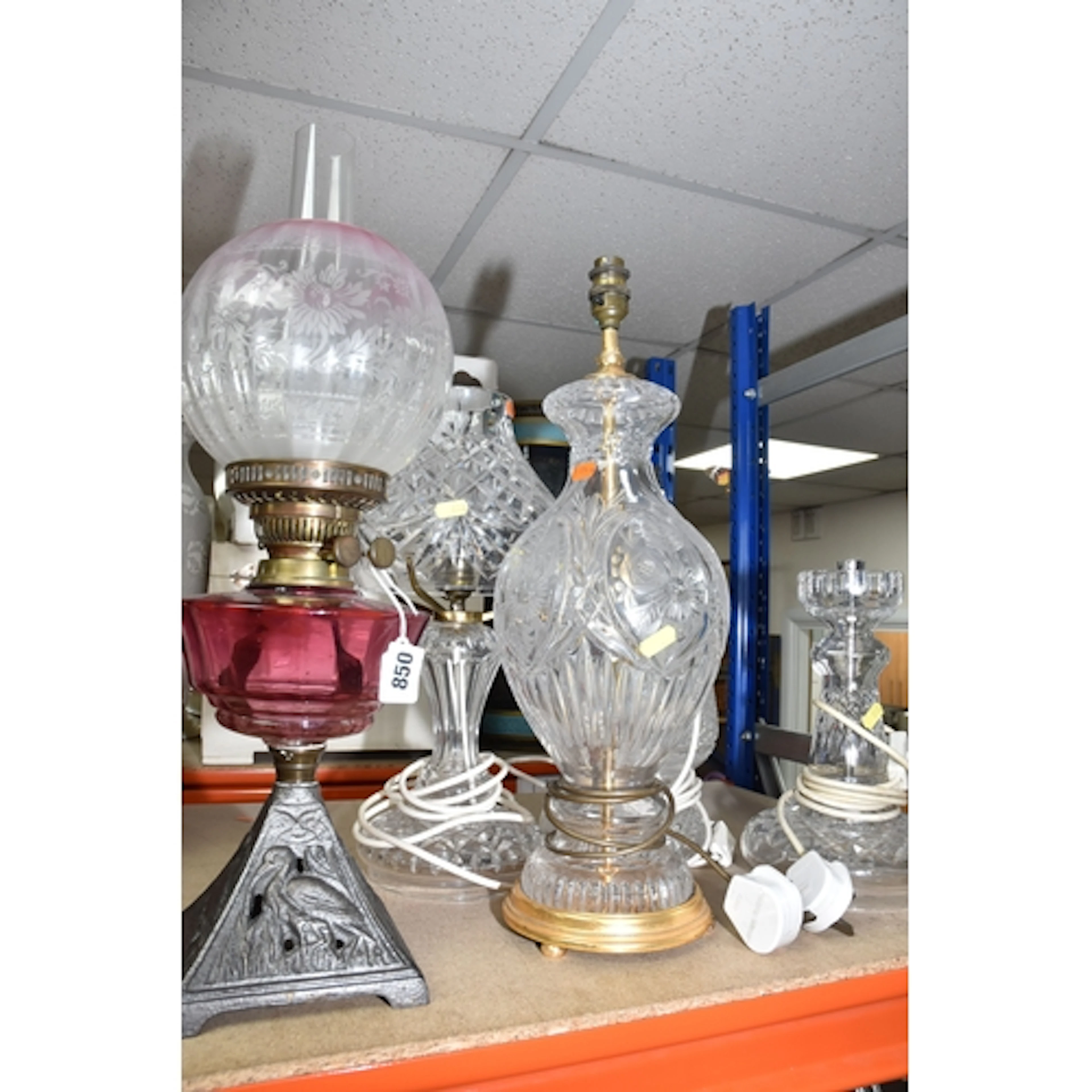 A GROUP OF FIVE ASSORTED LAMPS to include an oil lamp with a...