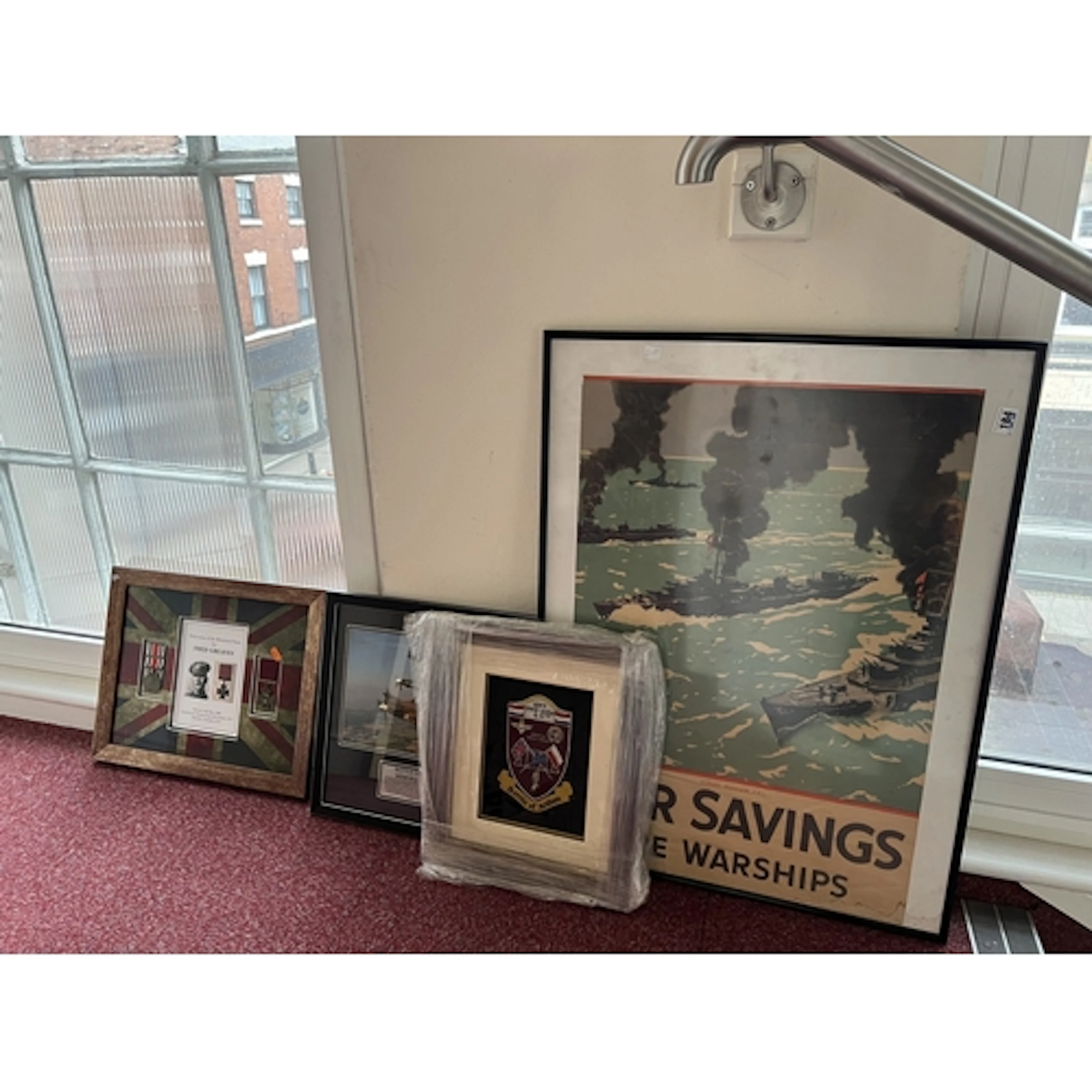 FOUR FRAMED ITEMS OF MILITARY INTEREST, to include a poster ...