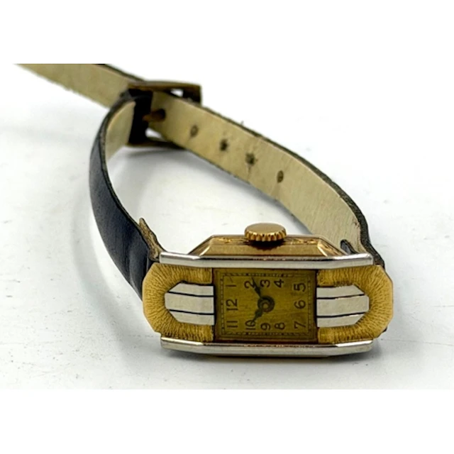 An 18ct Art Deco style watch on a leather strap.