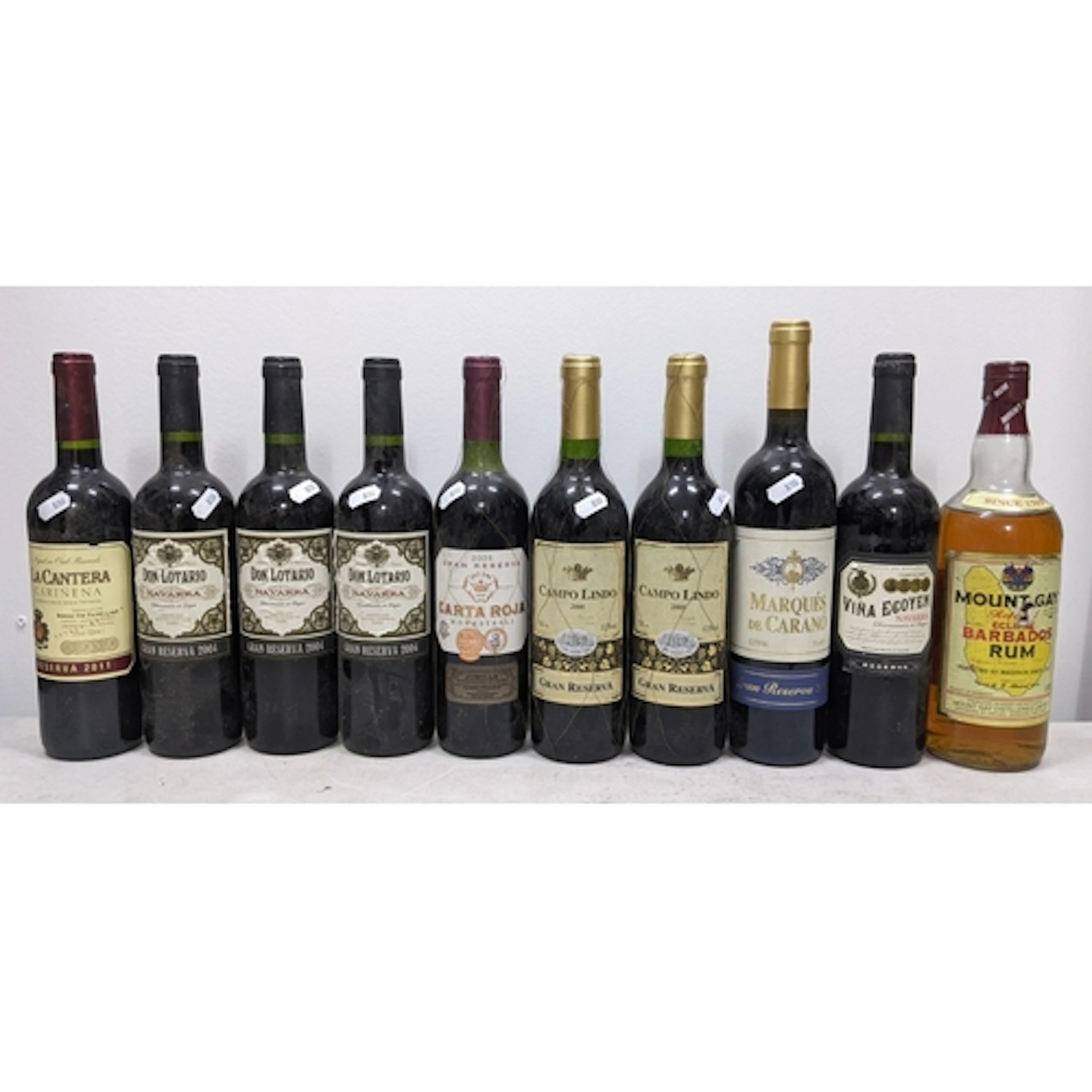 Ten bottles of assorted Spanish red wine and rum, comprising...