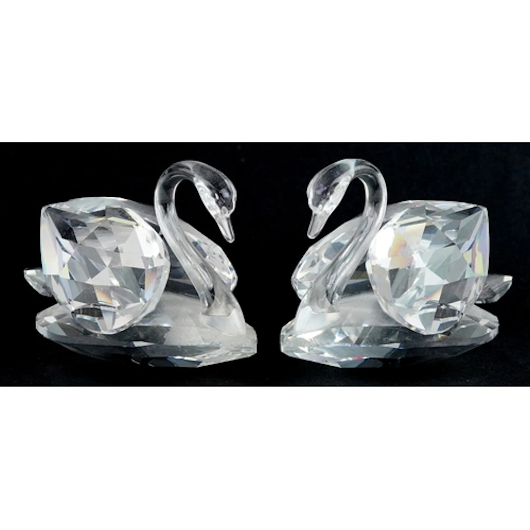 Pair of Swarovski crystal swans, each bearing Swarovski mark...