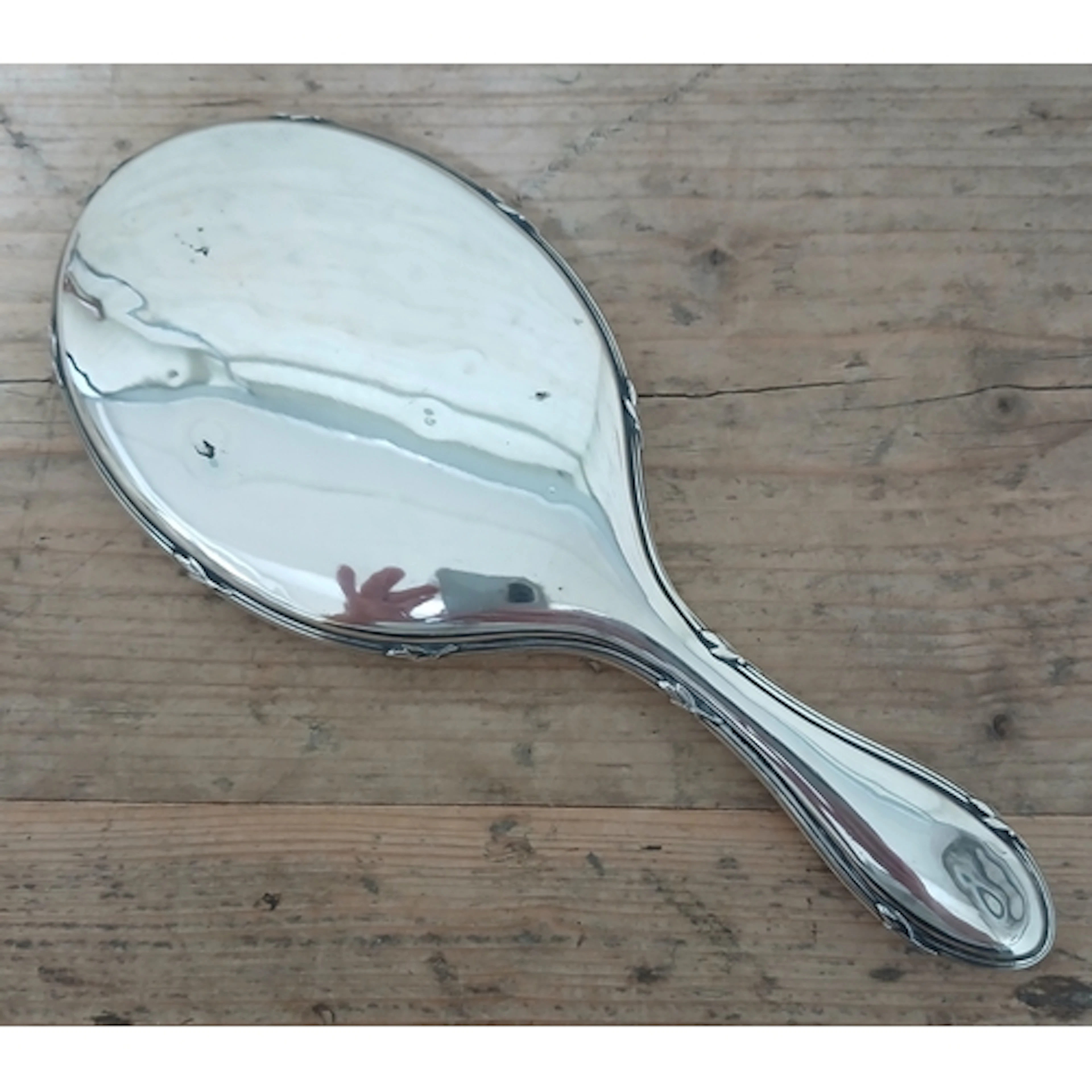 A Scandinavian silver backed mirror, length 26cm.