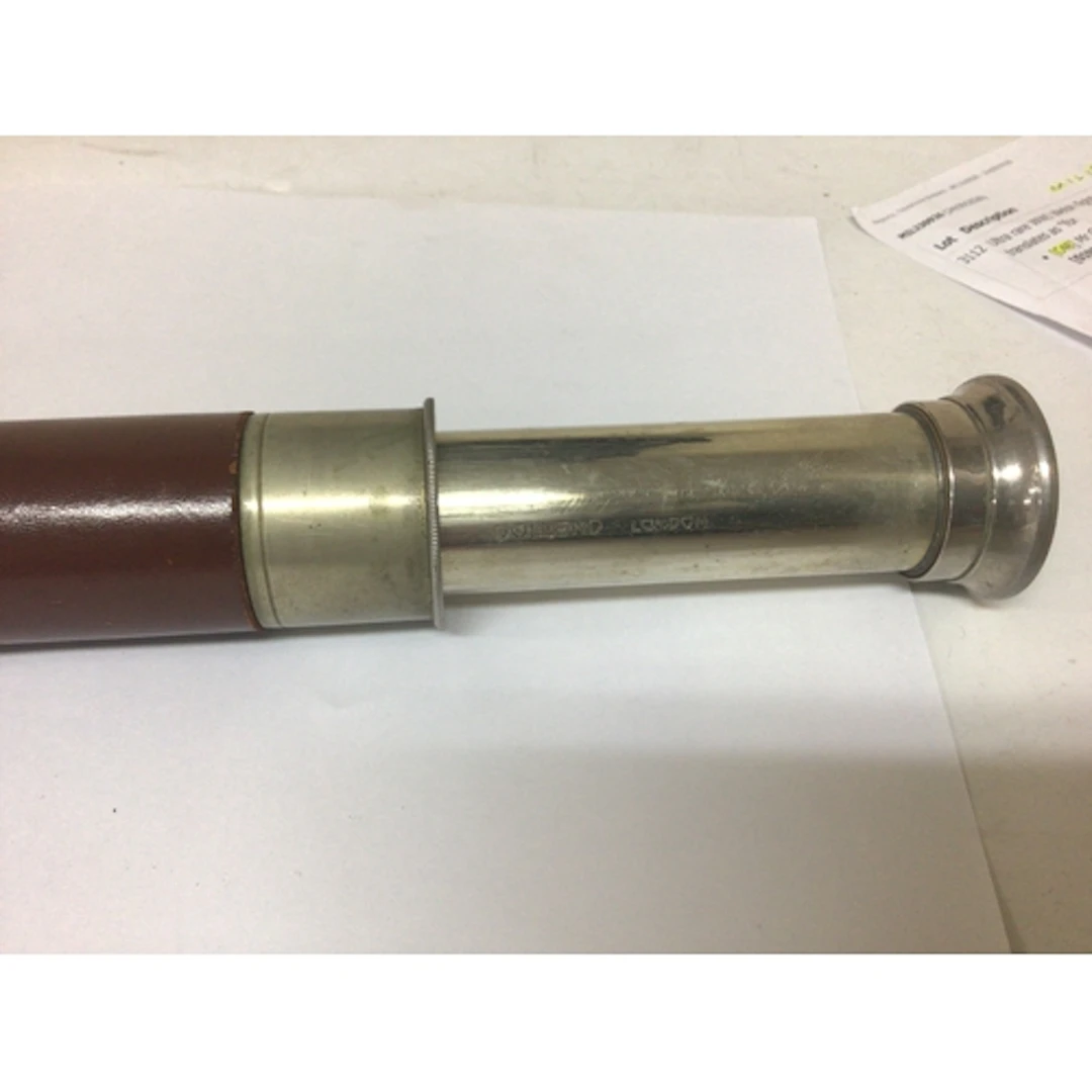 A leather cased chrome and polished steel telescope ma...