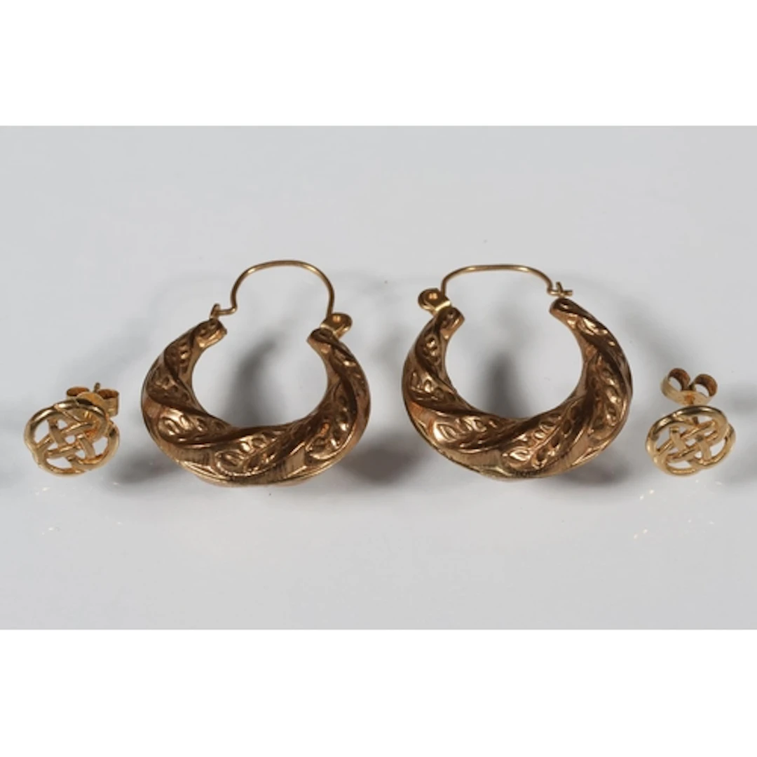 Two pairs of gold tone earrings, 2.2g gross.