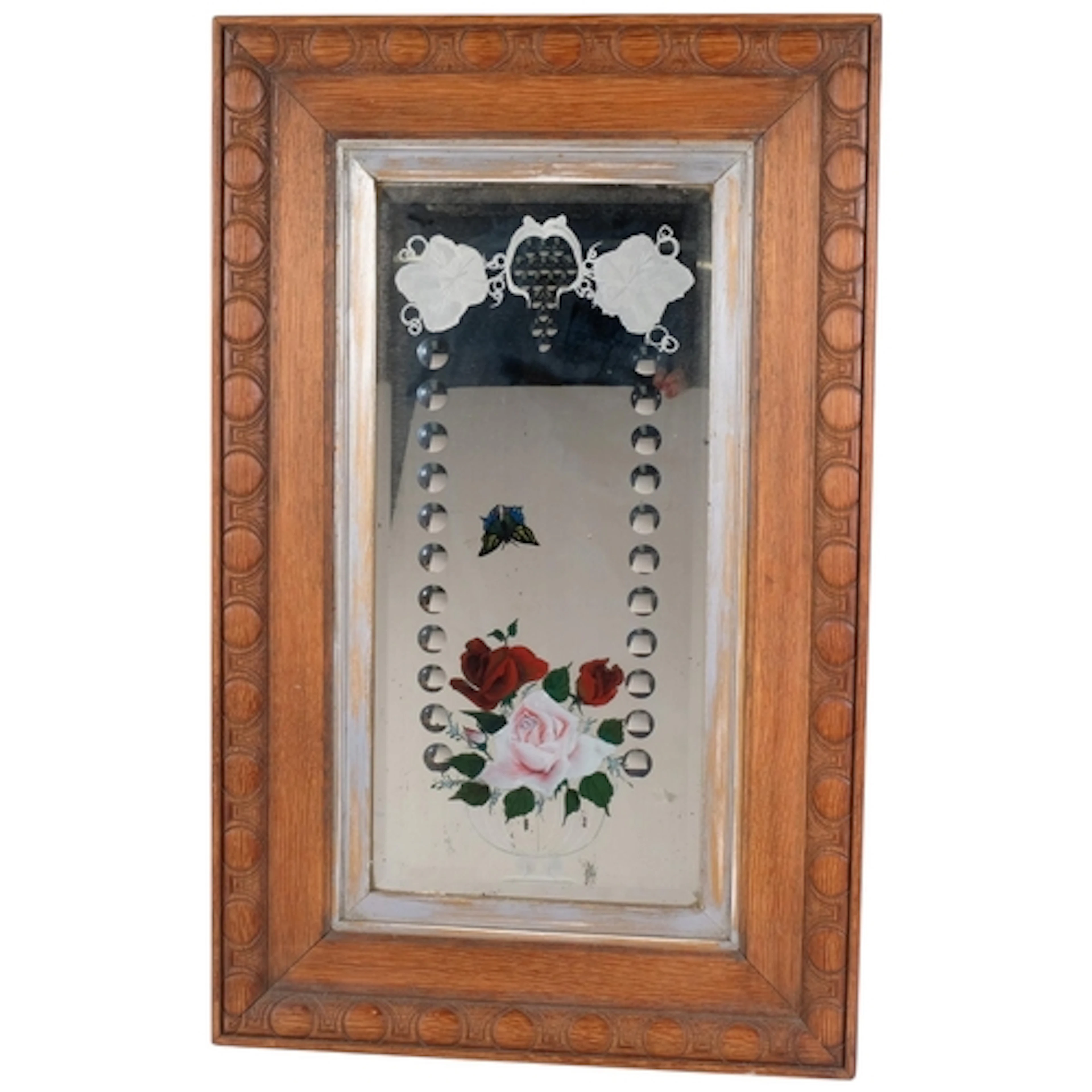 An early 20th century wall mirror, reverse painted and etche...