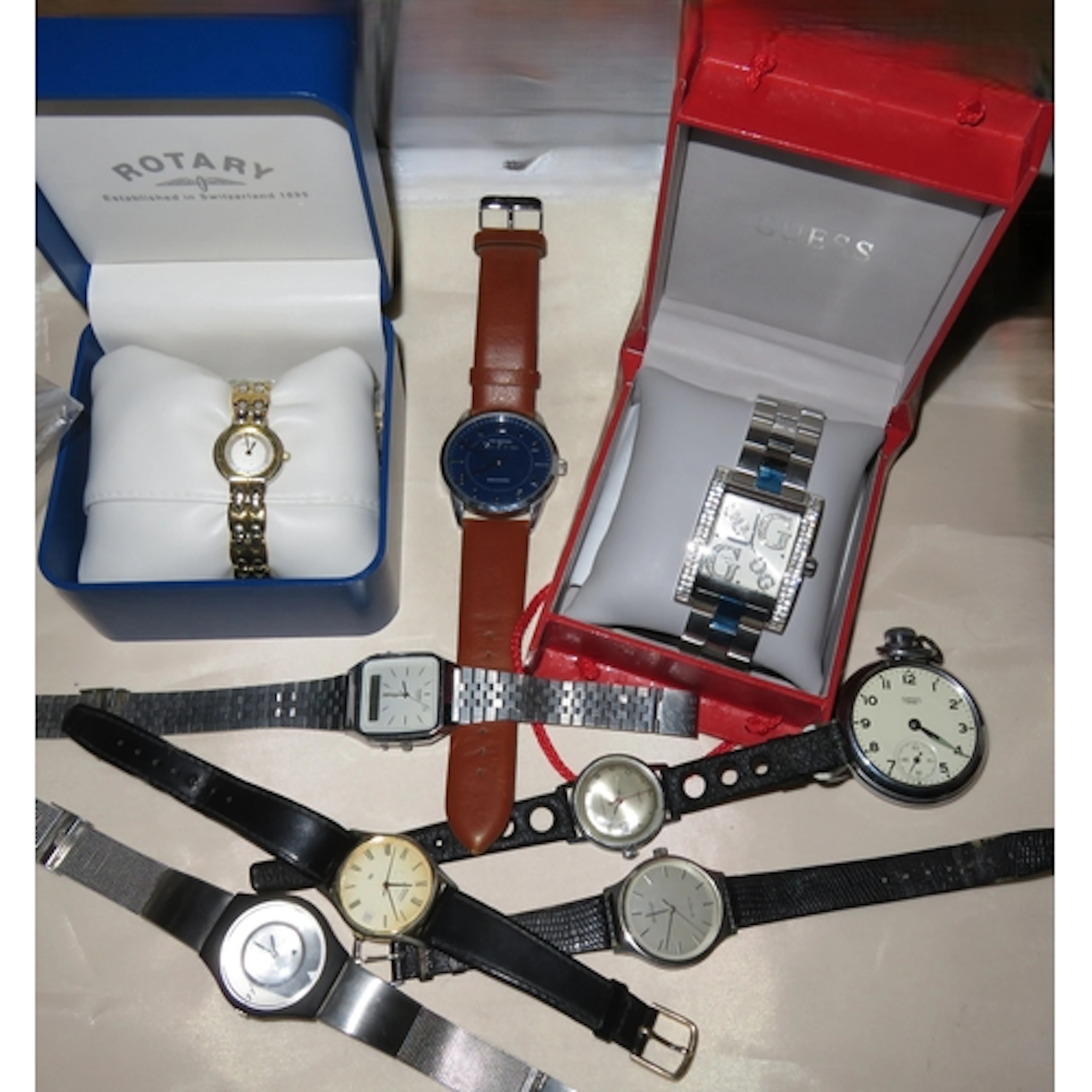 Two boxed wristwatches by Rotary and Guess, together with a ...