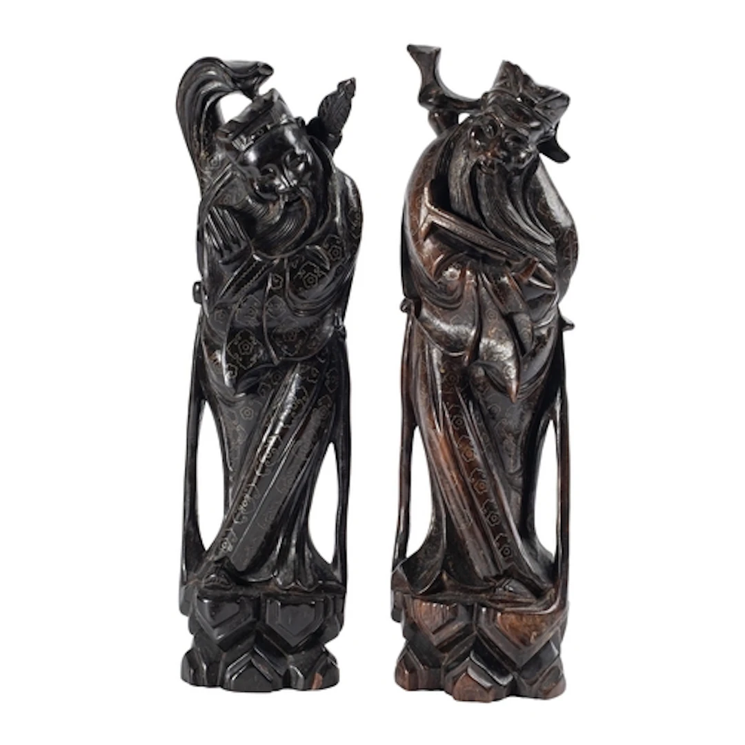 A pair of Chinese wire-inlaid carved hardwood figures of Imm...
