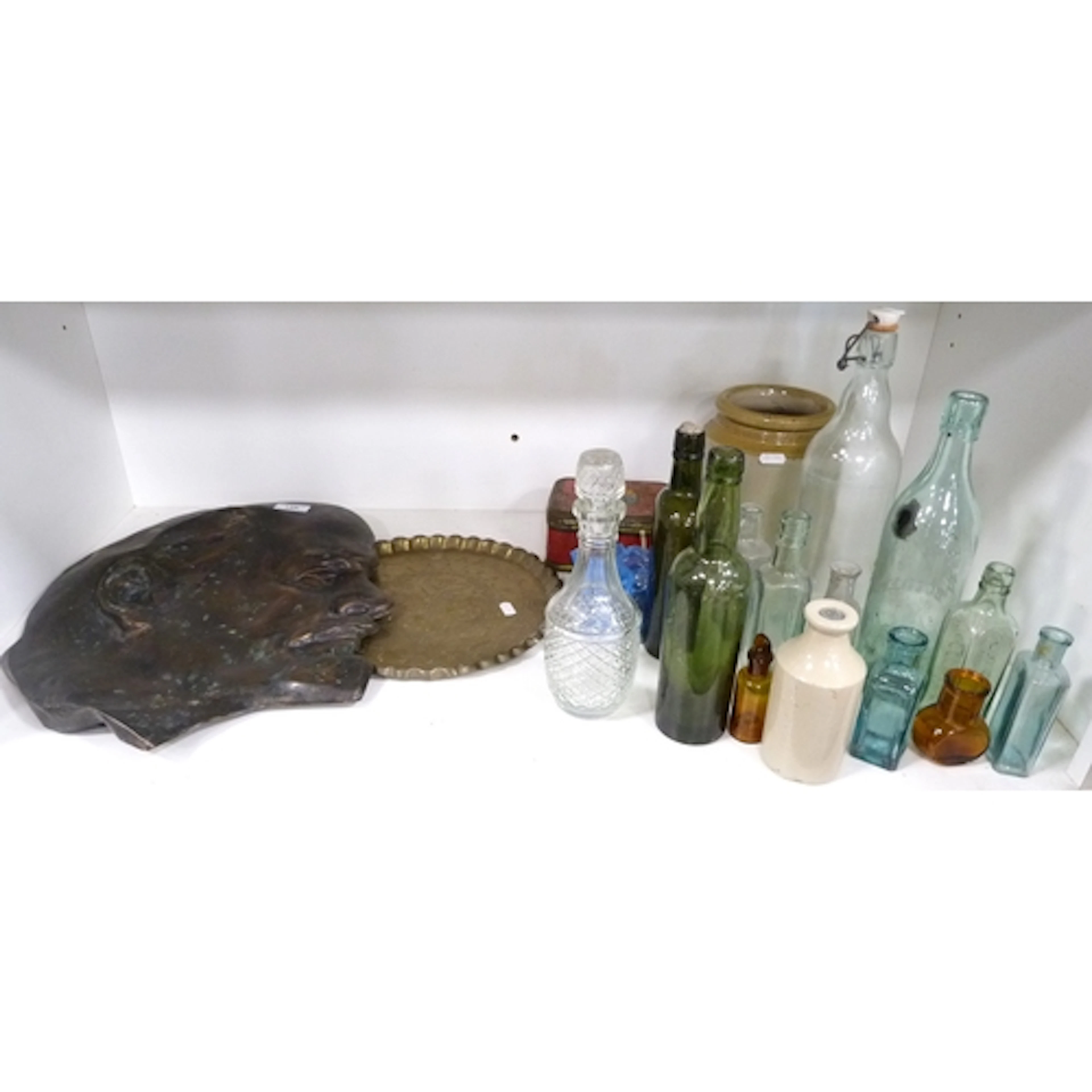 Shelf lot of assorted collectables to include glass bottles,...