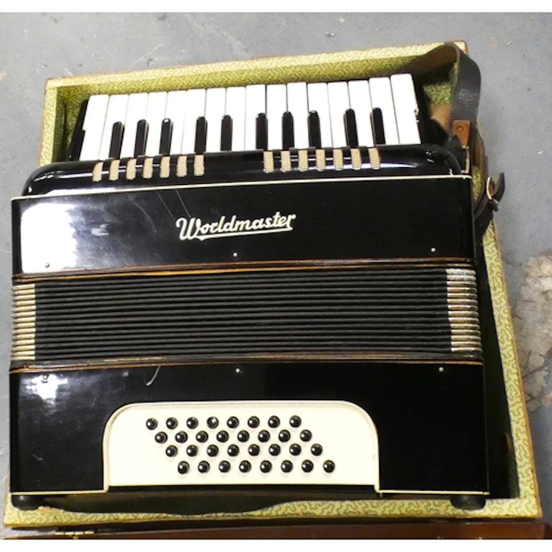 Worldmaster accordion in original box.