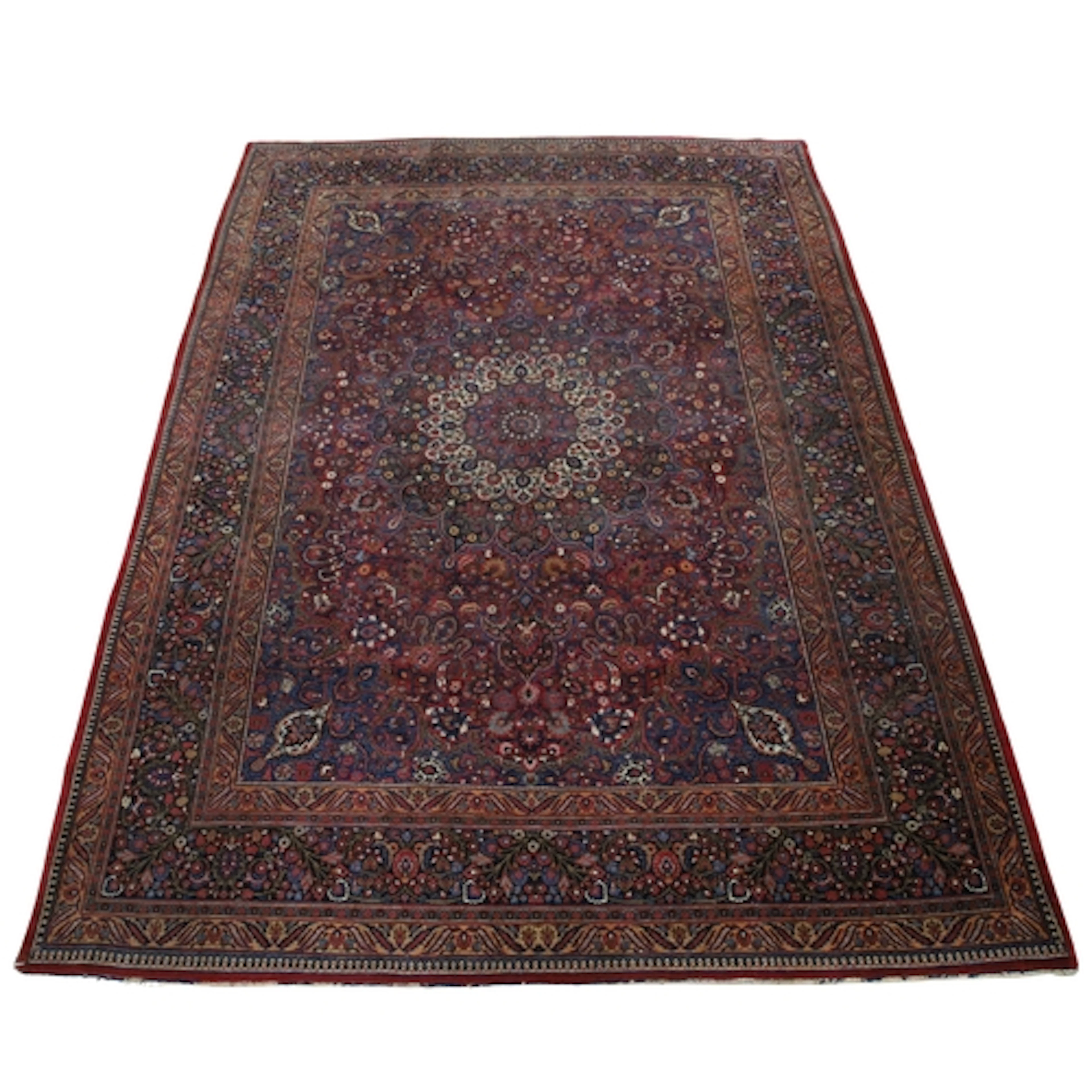 A MASHAD CARPET, KHORASAN, CIRCA 1925. The raspberry field r...