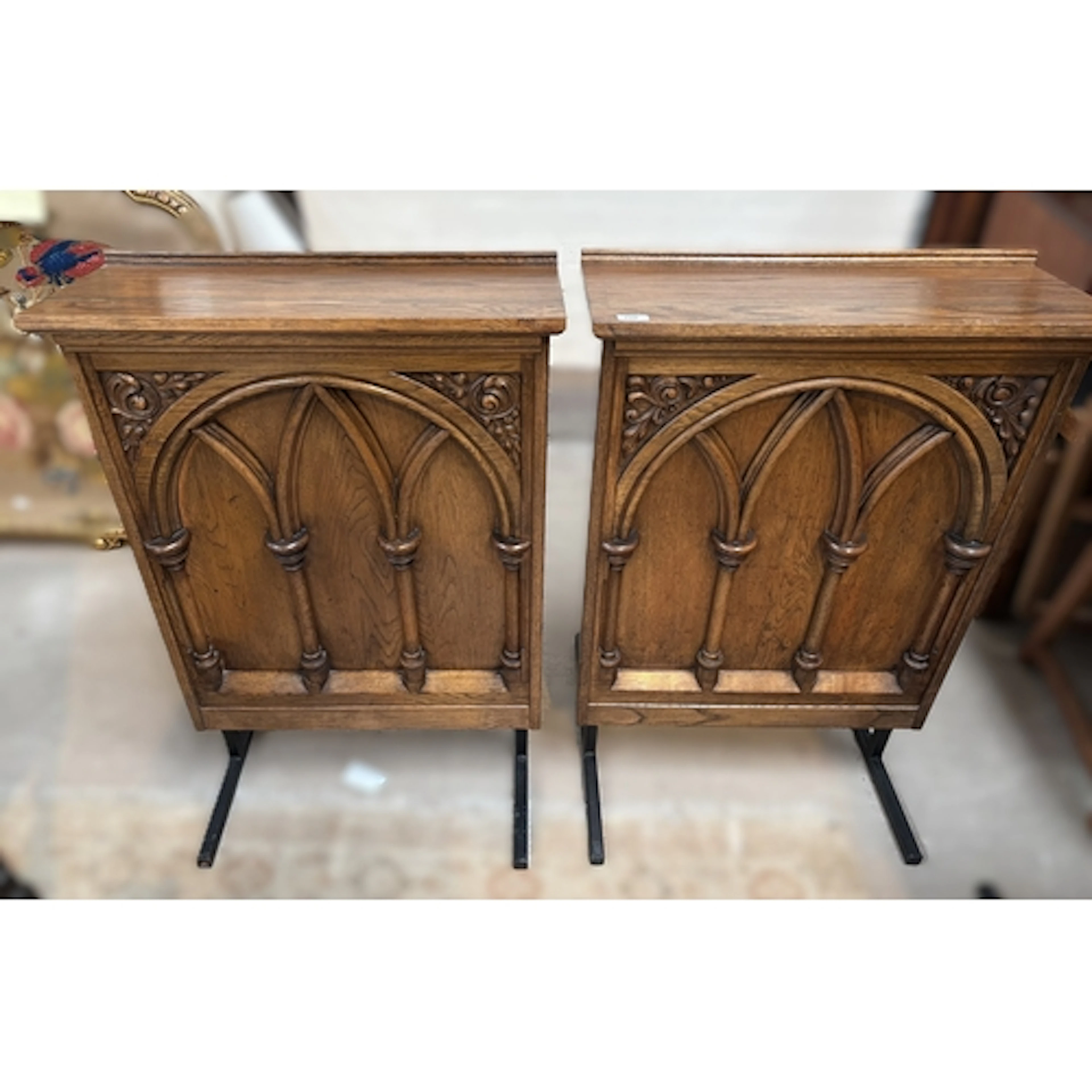 A pair of Gothic revival oak lecture stands, width 69cm x 28...