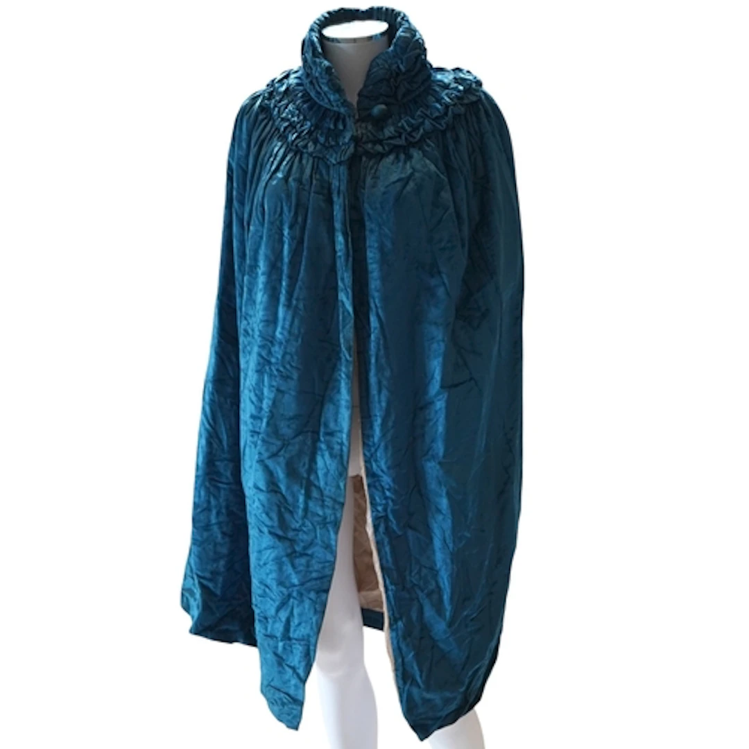 A 1920's lady's turquoise silk velvet opera cape with large ...
