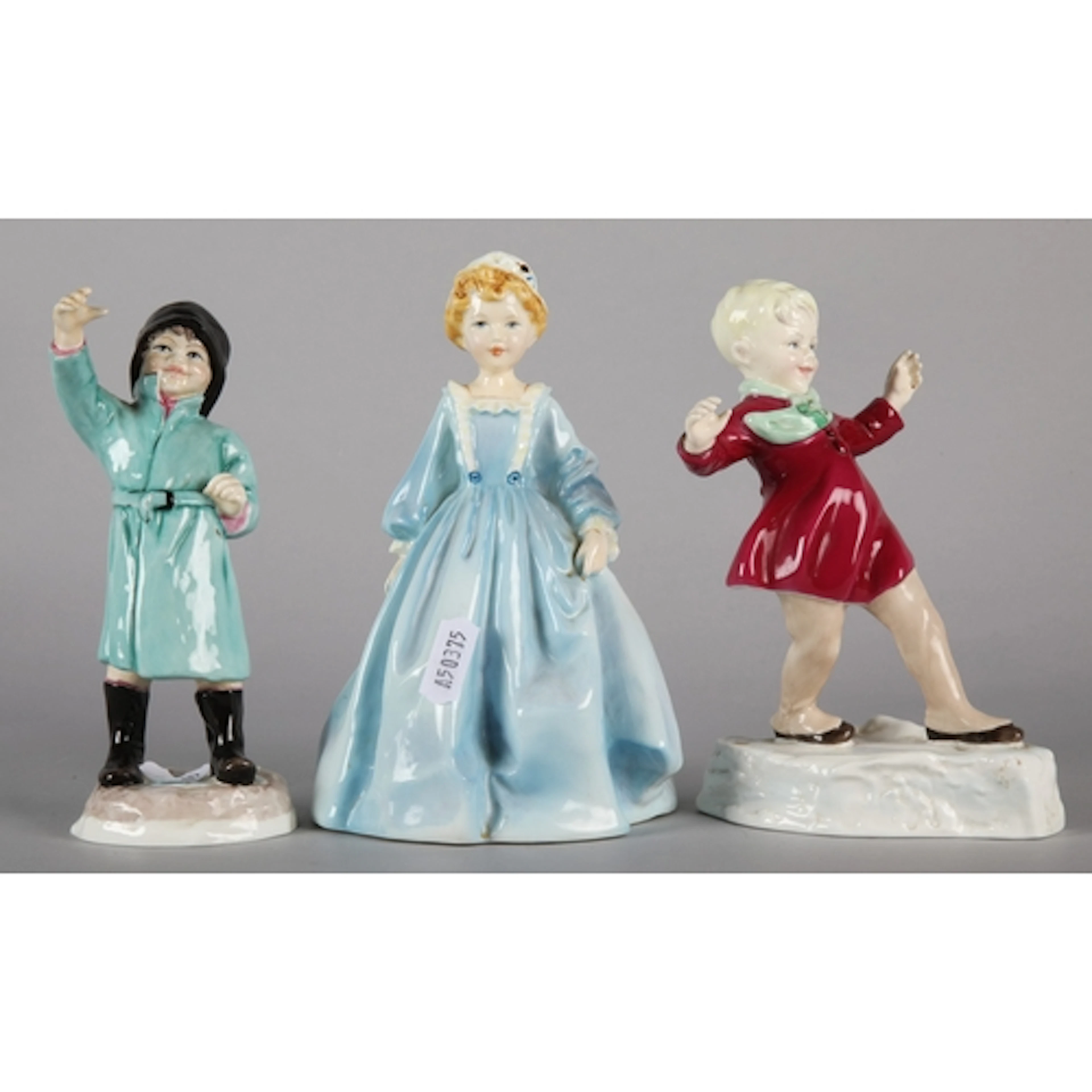 Three Royal Worcester child figures. (3)