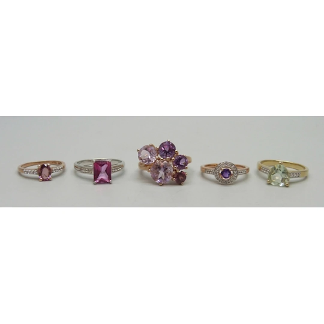 Four silver gilt gemstone rings and a silver ring including ...