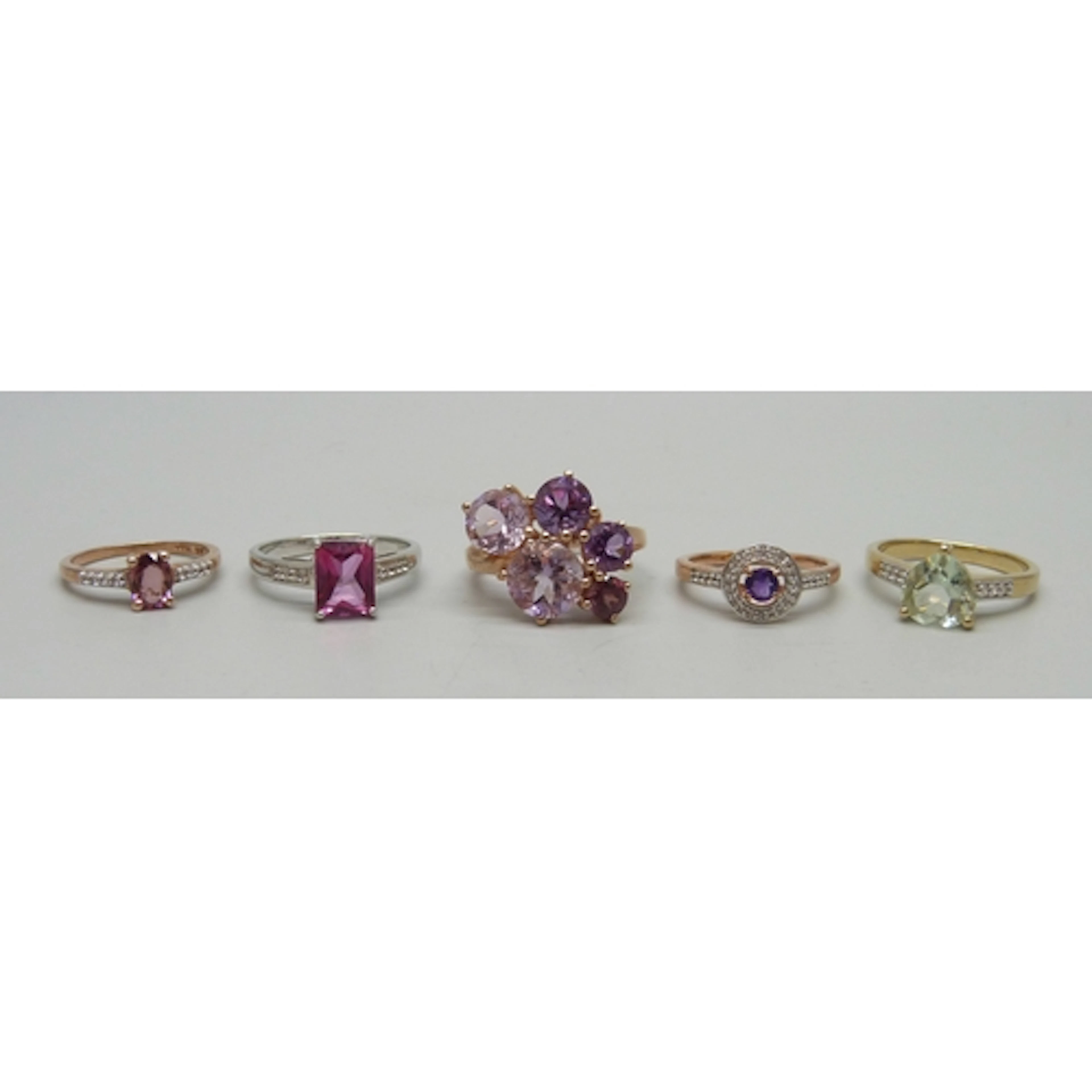 Four silver gilt gemstone rings and a silver ring including ...